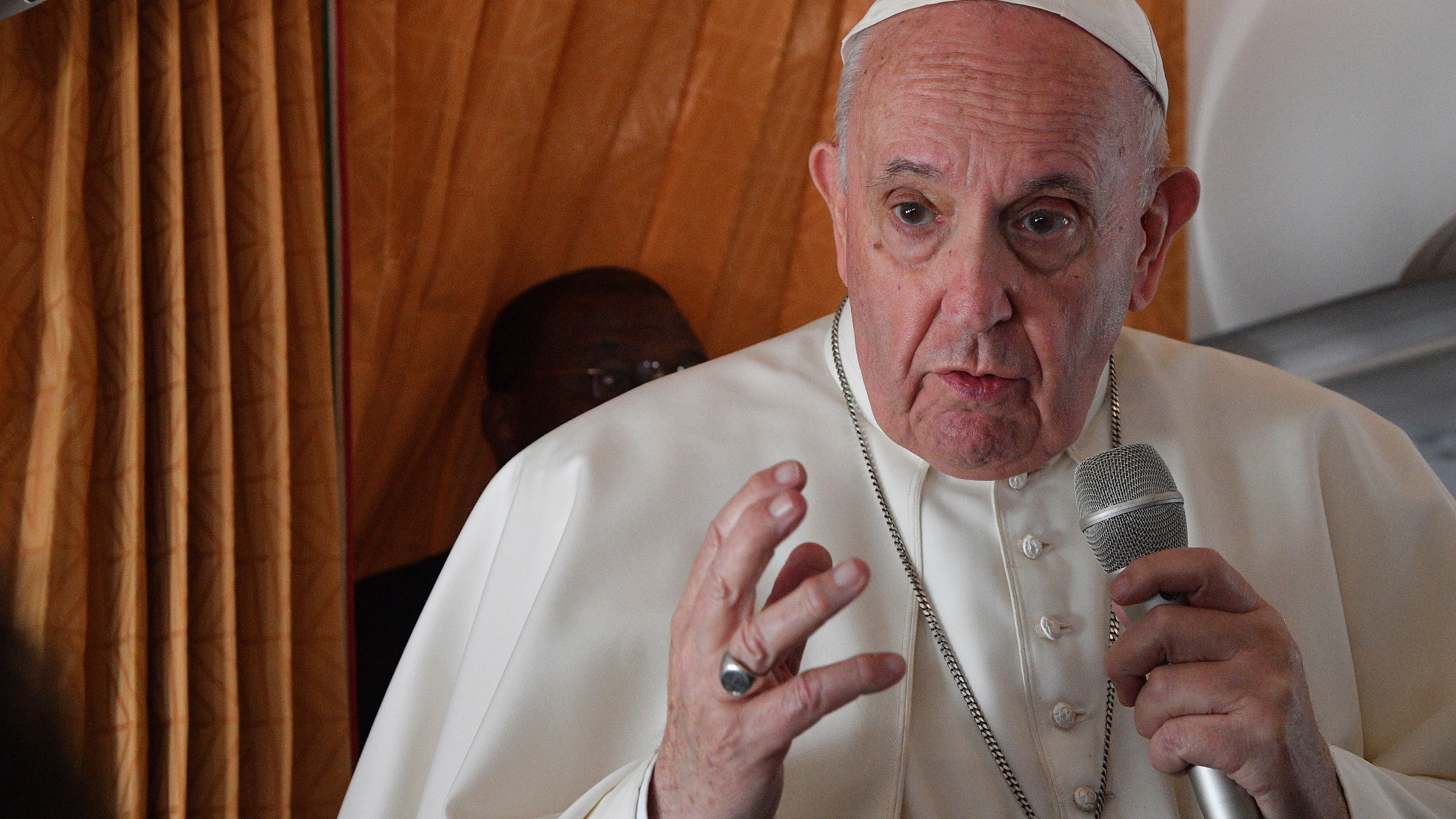 Pope Francis speaks with journalists on board an Alitalia aircraft enroute from Bratislava back to Rome on Sept. 15, 2021 after a four-day pilgrimage to Hungary and Slovakia. (Tiziana Fabi, Pool via Associated Press)