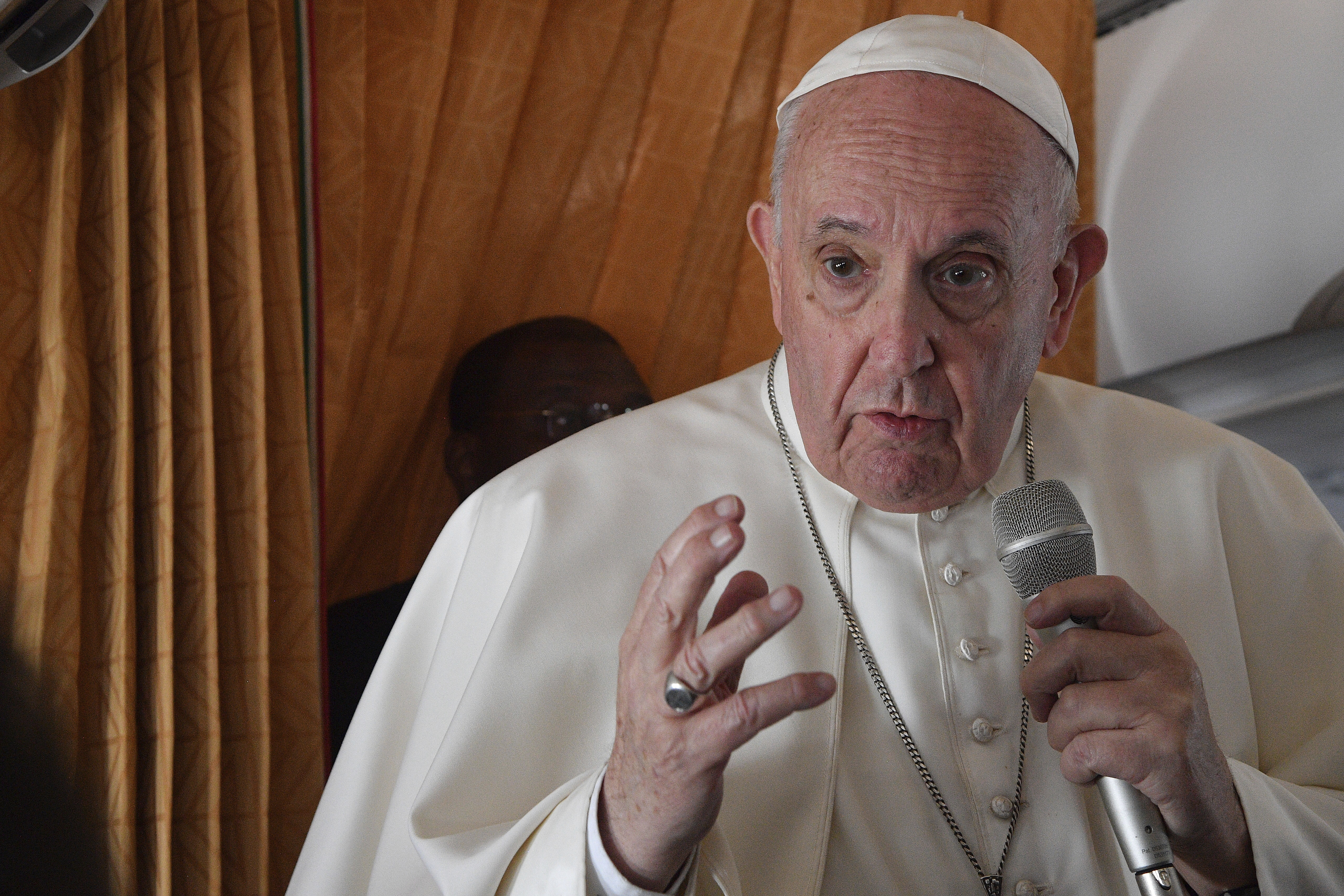 Pope Francis speaks with journalists on board an Alitalia aircraft enroute from Bratislava back to Rome on Sept. 15, 2021 after a four-day pilgrimage to Hungary and Slovakia. (Tiziana Fabi, Pool via Associated Press)