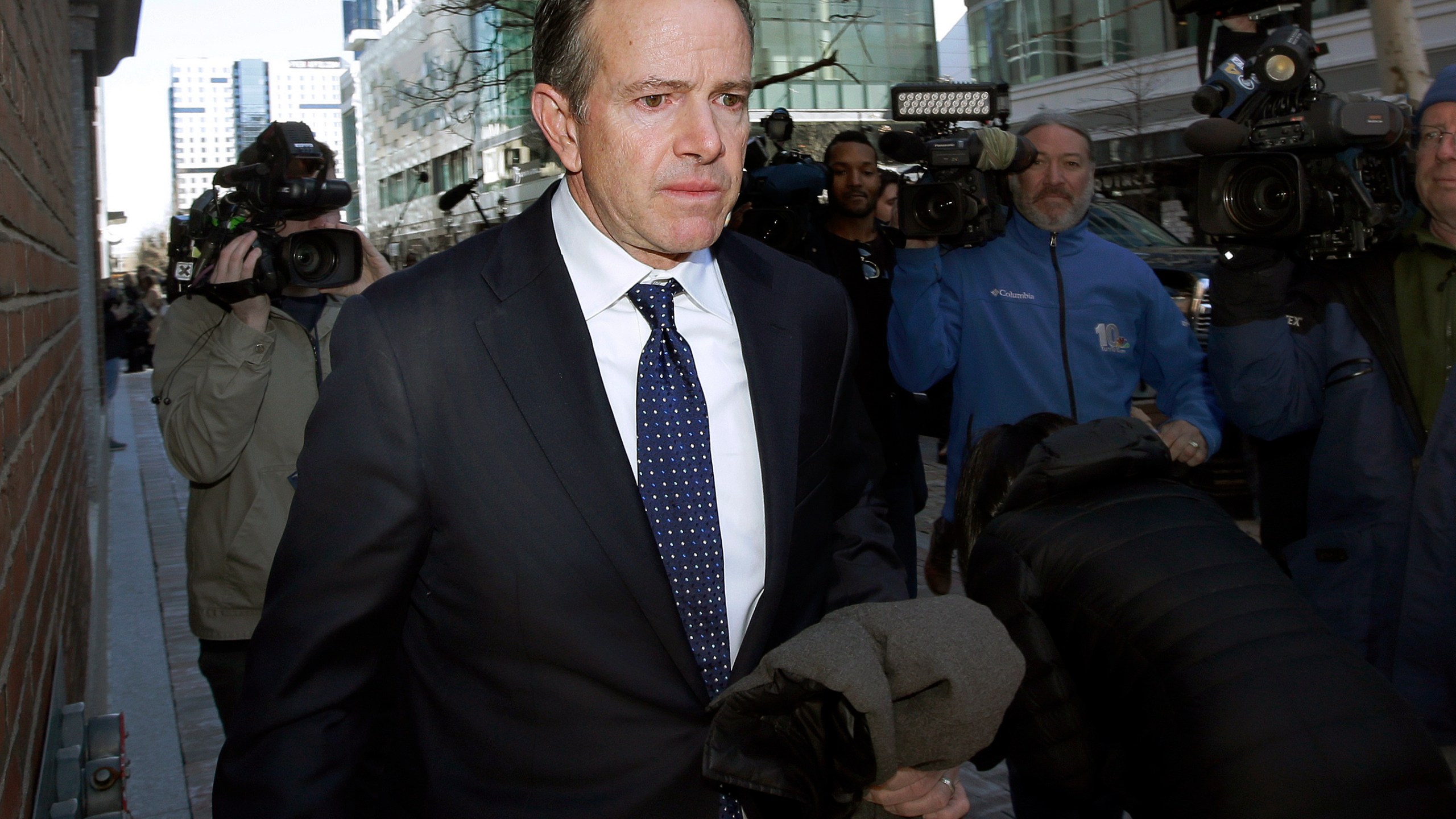 In this March 25, 2019 file photo, Gordon Ernst, former Georgetown tennis coach, departs federal court in Boston after facing charges in a nationwide college admissions bribery scandal. (Steven Senne/Associated Press)