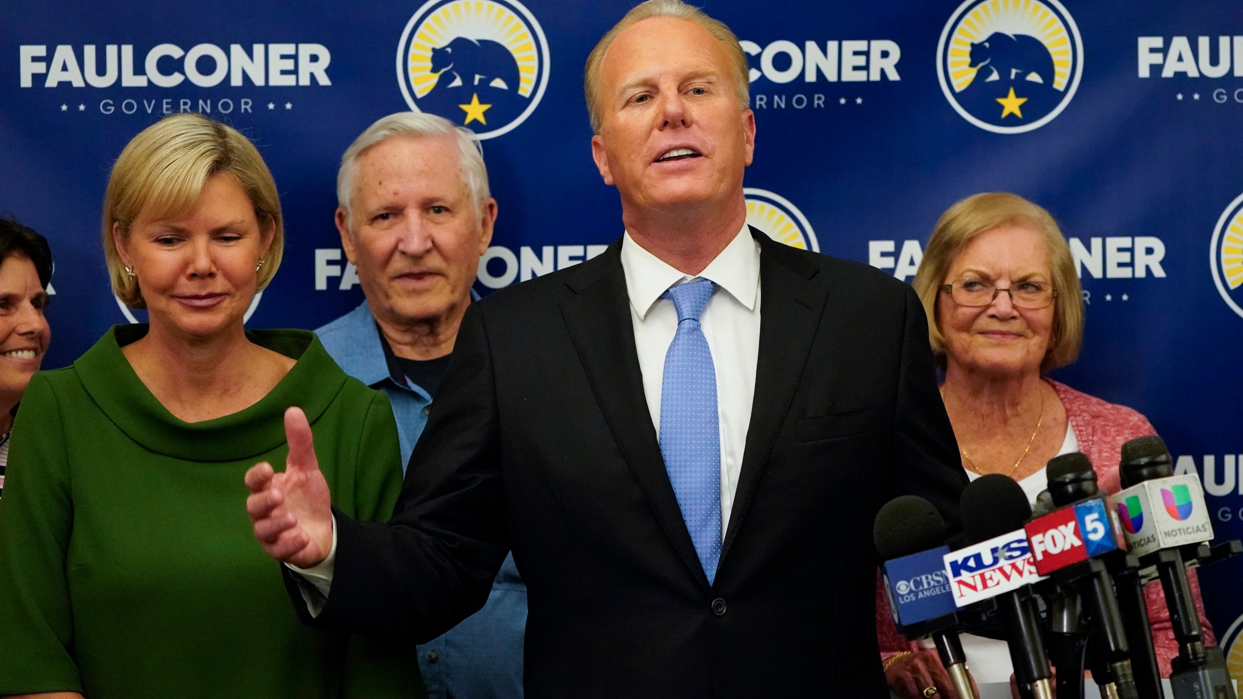 Kevin Faulconer, former San Diego mayor and Republican candidate for governor of California, speaks alongside his wife, Katherine Faulconer, left, at his campaign headquarters after polls closed in the recall election on Sept. 14, 2021, in San Diego. (Gregory Bull/Associated Press)