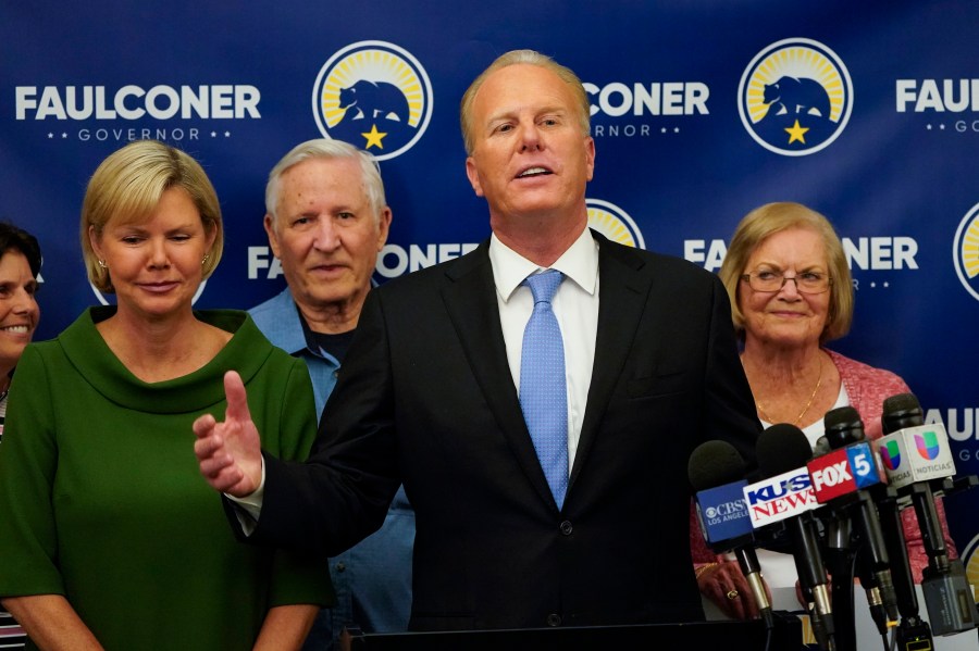 Kevin Faulconer, former San Diego mayor and Republican candidate for governor of California, speaks alongside his wife, Katherine Faulconer, left, at his campaign headquarters after polls closed in the recall election on Sept. 14, 2021, in San Diego. (Gregory Bull/Associated Press)