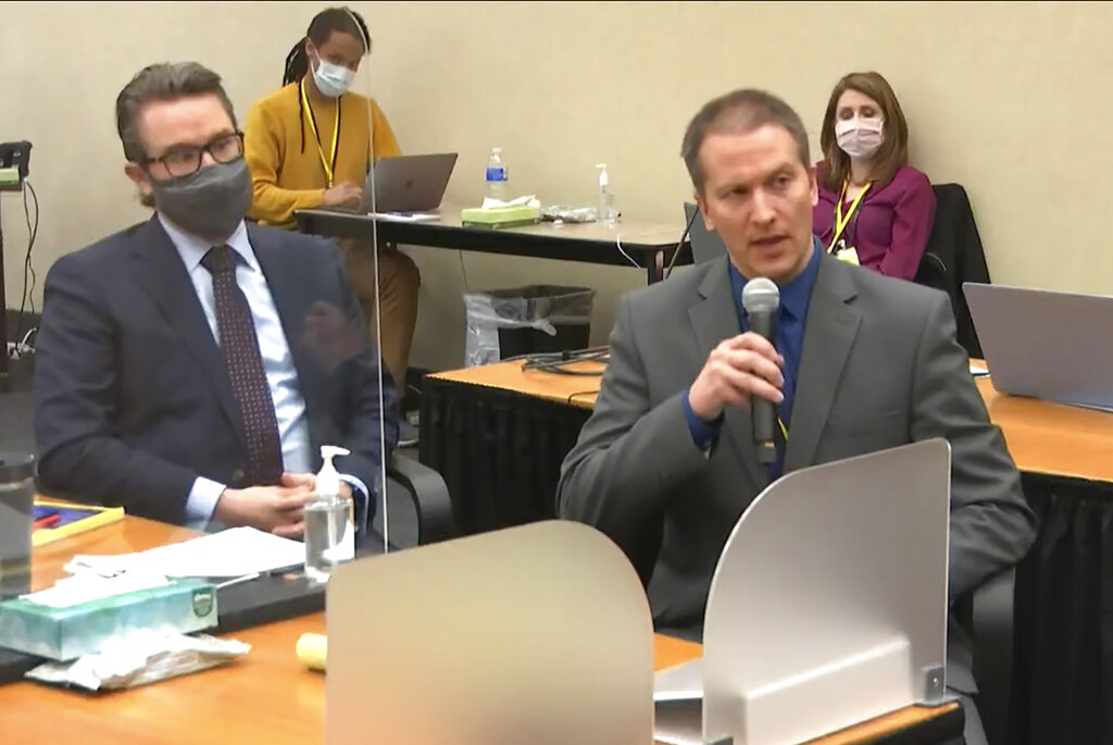 In this April 15, 2021, file image from video, defense attorney Eric Nelson, left, and defendant, former Minneapolis police Officer Derek Chauvin, address Hennepin County Judge Peter Cahill at the Hennepin County Courthouse in Minneapolis. (Court TV via AP, Pool File)