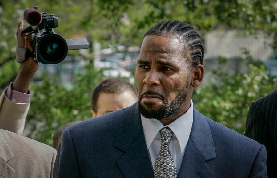 This photo from Friday May 9, 2008, shows R. Kelly arriving for the first day of jury selection in his child pornography trial at the Cook County Criminal Courthouse in Chicago. (Charles Rex Arbogast/Associated Press)