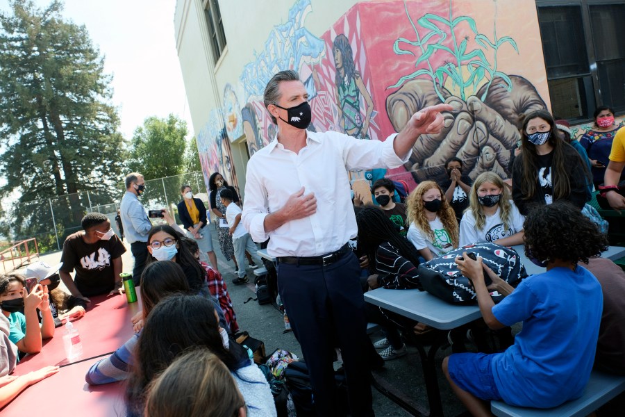 Gov. Gavin Newsom meets with students at Melrose Leadership Academy, a TK-8 school in Oakland, Calif., on Wednesday, Sept. 15, 2021, one day after defeating a Republican-led recall effort. The recall election that once threatened Newsom's political career has instead given it new life. (AP Photo/Nick Otto)