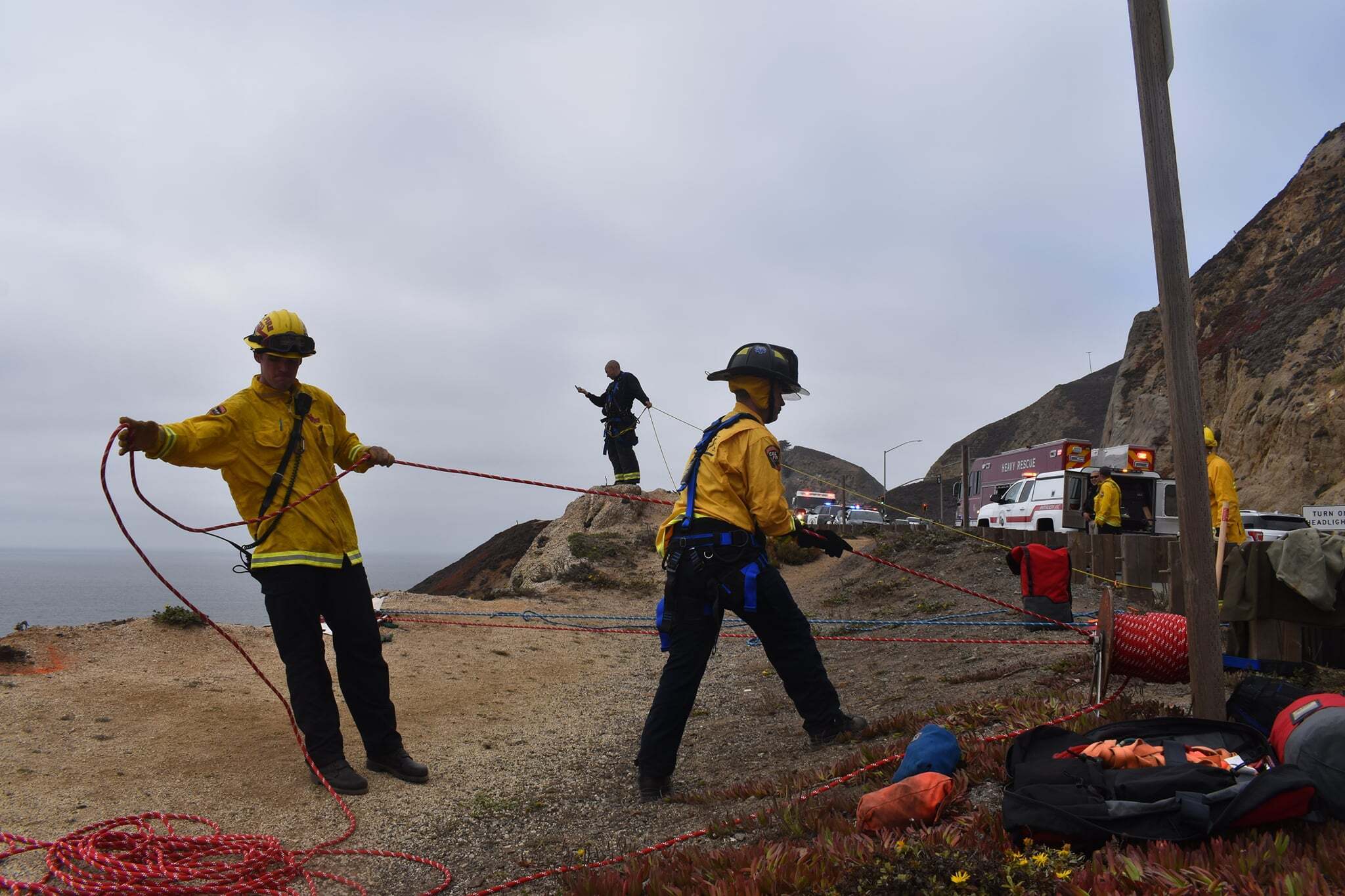 In this photo provided by Cal Fire San Mateo, Santa Cruz Unit firefighters recover a vehicle that plunged off a cliffside road killing a man south of San Francisco on Sept. 15, 2021. (CAL FIRE San Mateo - Santa Cruz Unit via Associated Press)