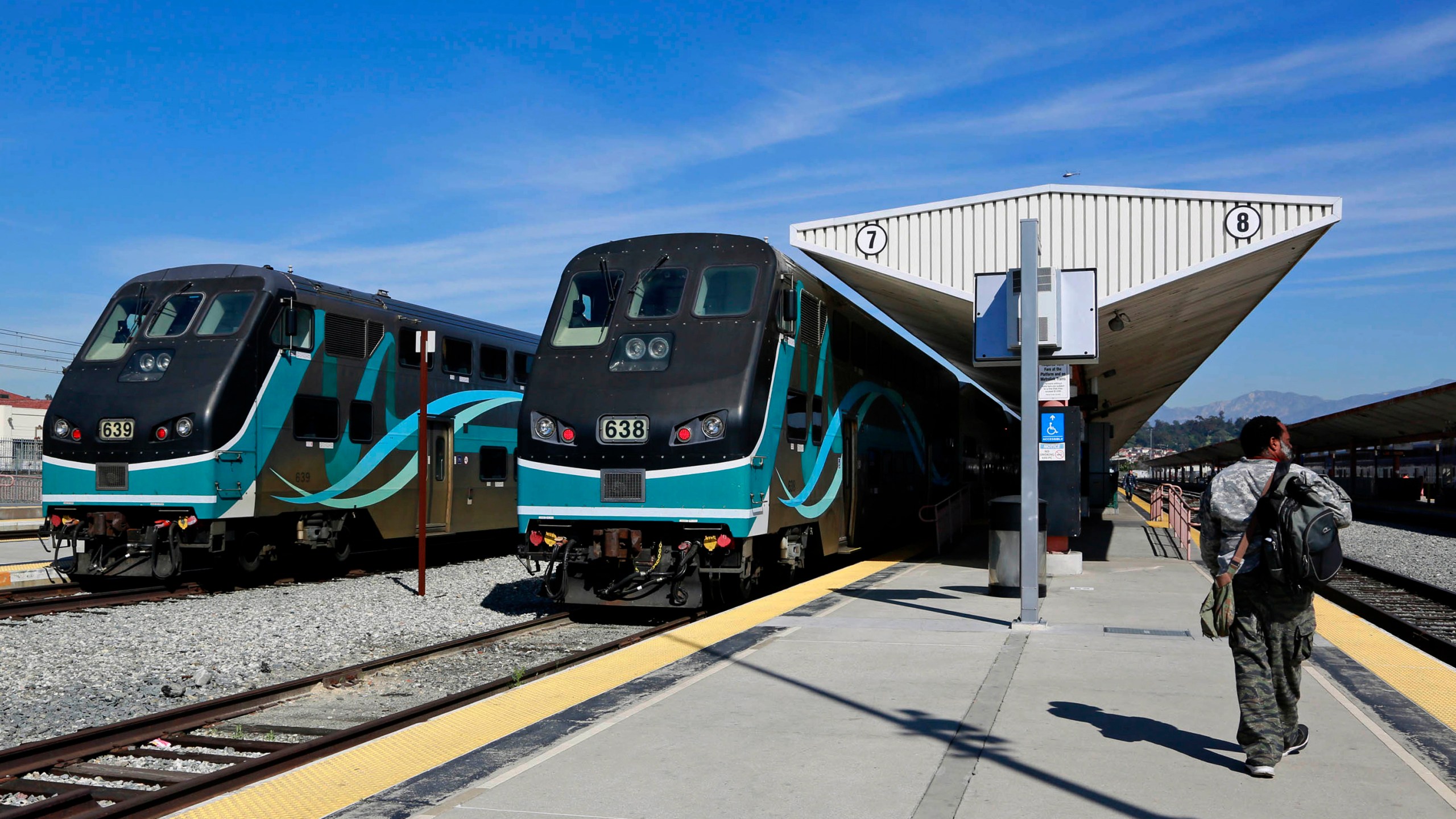 In this Feb. 25, 2015, file photo, Metrolink commuter trains stand at a platform at Union Station in downtown Los Angeles. (AP Photo/Nick Ut, File)