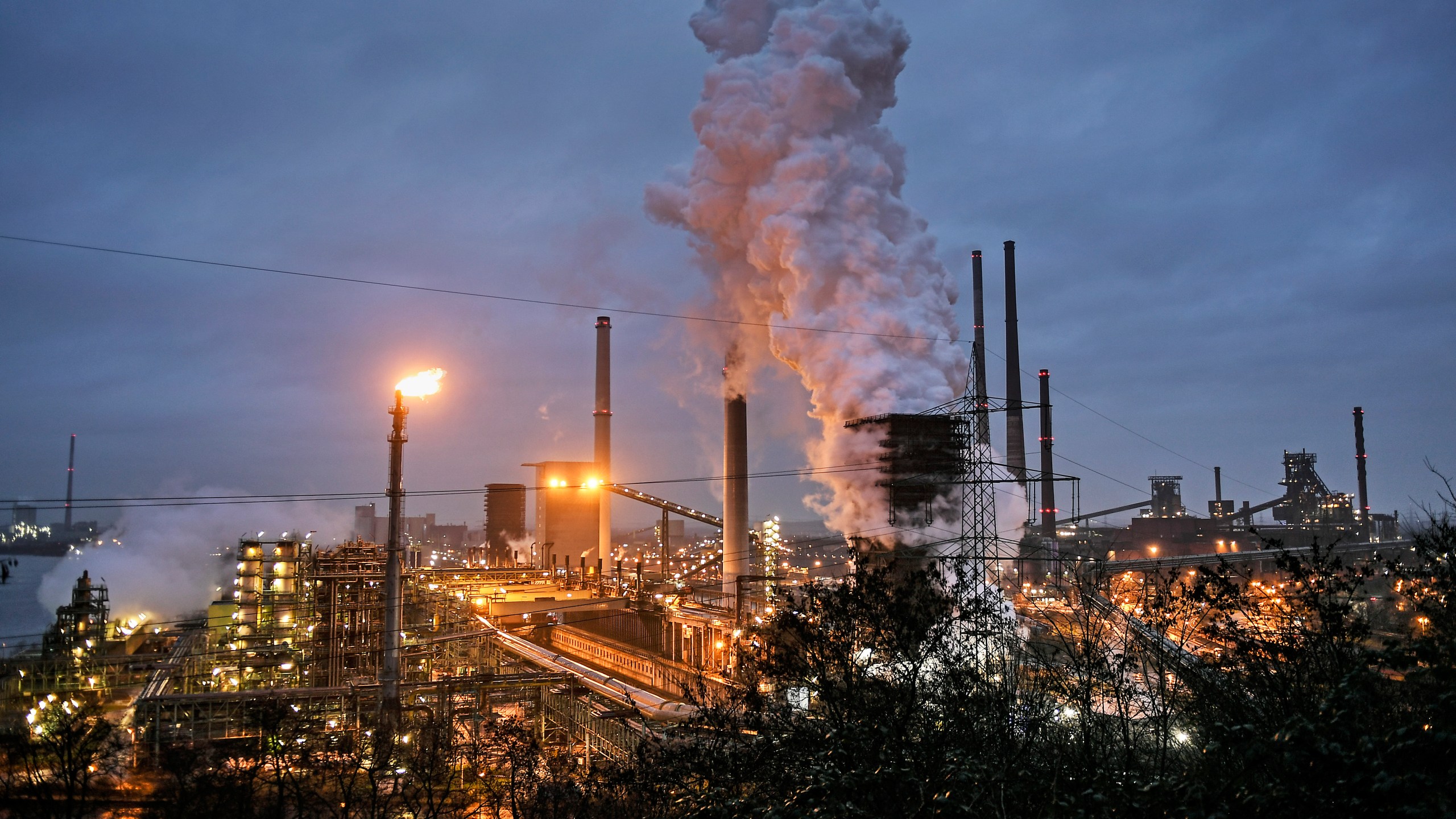 A ThyssenKrupp coking plant steams around the clock for the nearby steel mill in Duisburg, Germany, on Jan. 30, 2020. (Martin Meissner / Associated Press)