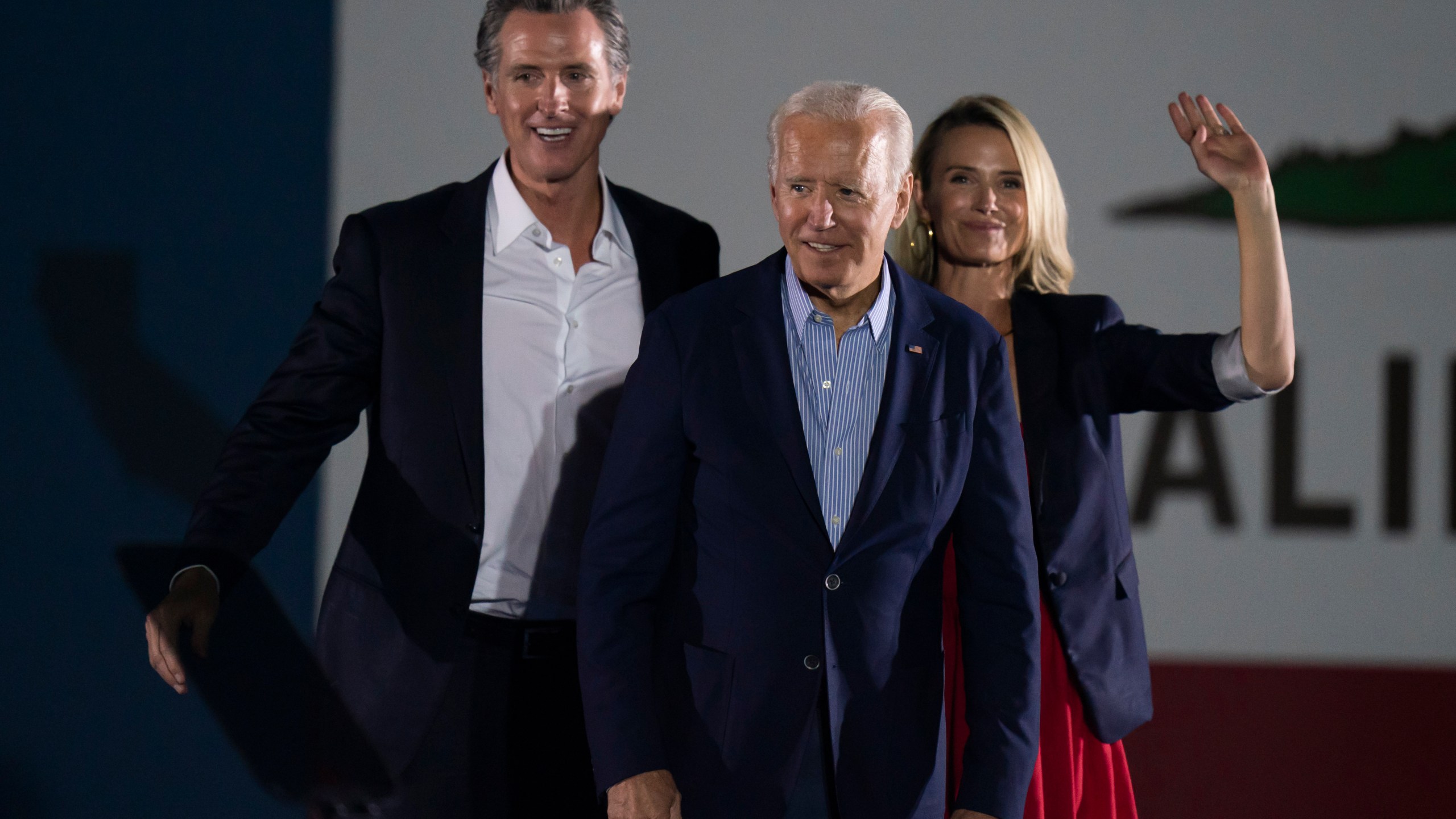 In this Sept. 13, 2021, file photo President Joe Biden, center, smiles to the crowd as he is flanked by California Gov. Gavin Newsom and Jennifer Siebel Newsom at a rally ahead of the California gubernatorial recall election in Long Beach, Calif. (AP Photo/Jae C. Hong, File)