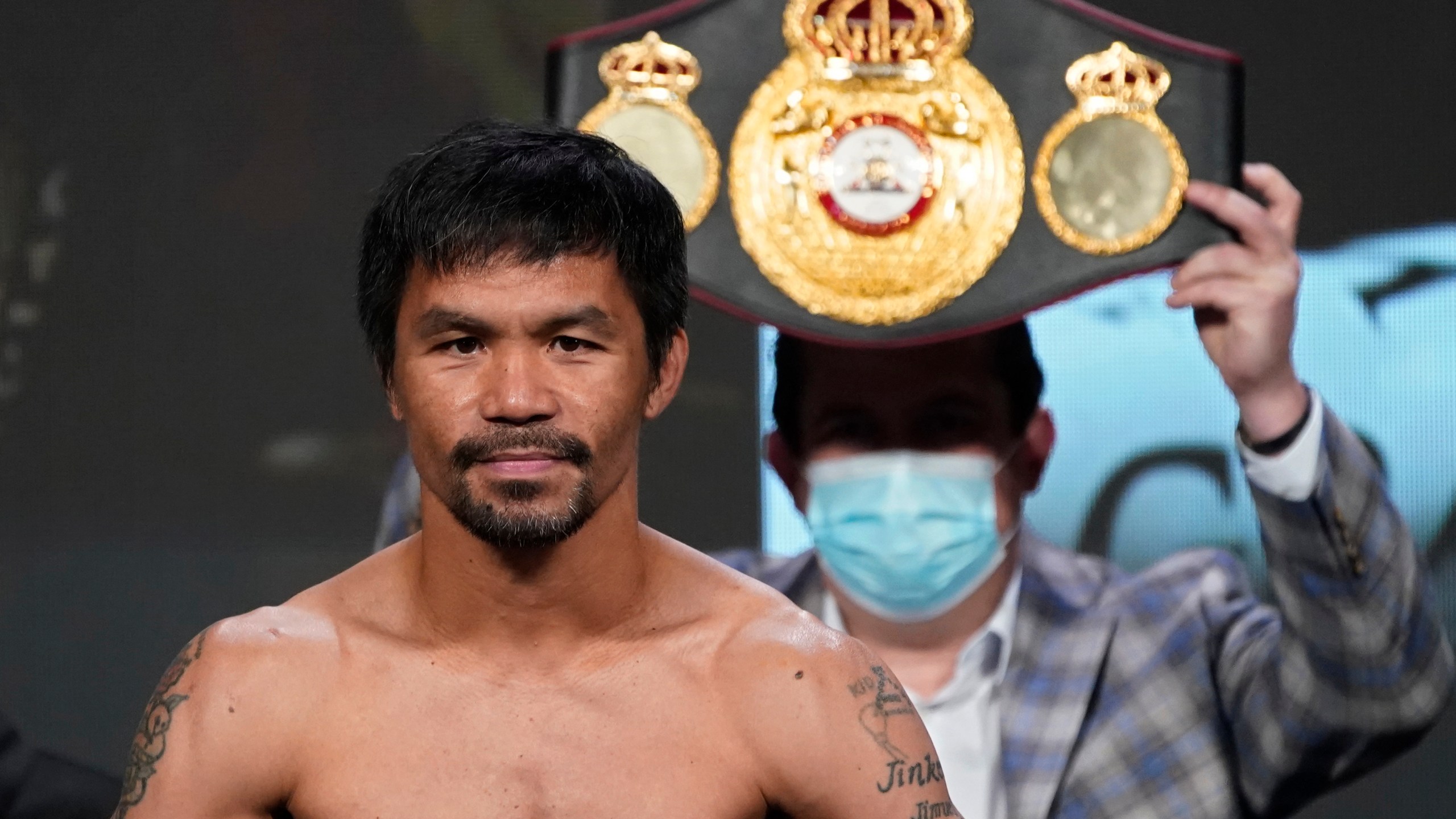 In this Aug. 20, 2021, file photo, Manny Pacquiao, of the Philippines, poses for photographers during a weigh-in in Las Vegas. (AP Photo/John Locher, File)