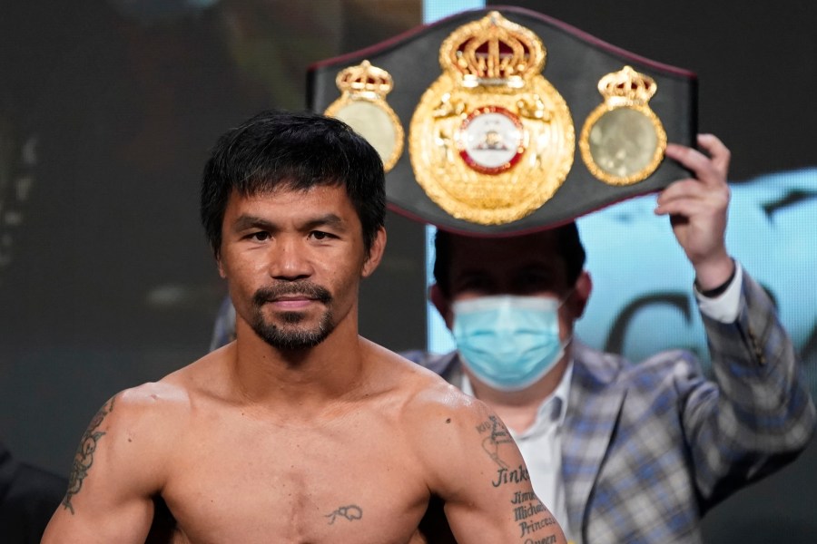 In this Aug. 20, 2021, file photo, Manny Pacquiao, of the Philippines, poses for photographers during a weigh-in in Las Vegas. (AP Photo/John Locher, File)