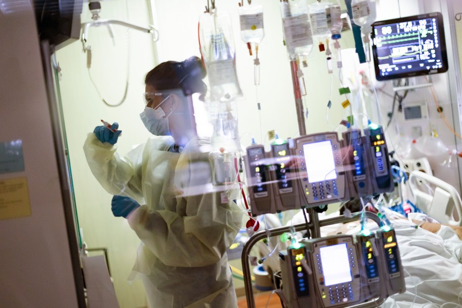 In this Aug. 31, 2021, file photo, Ann Enderle R.N. attends to a COVID-19 patient in the Medical Intensive care unit (MICU) at St. Luke's Boise Medical Center in Boise, Idaho. (AP Photo/Kyle Green, File)