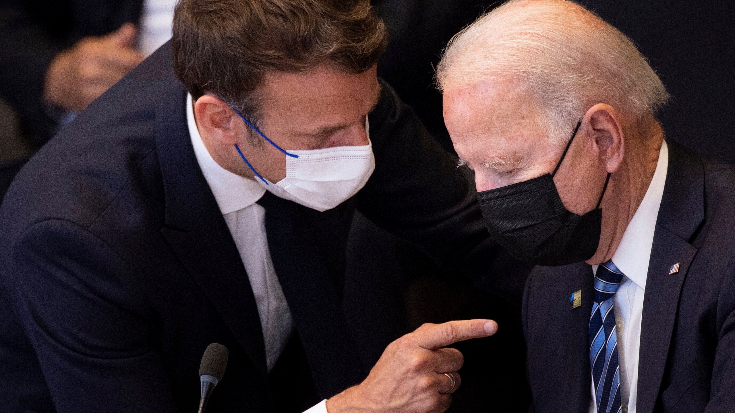 In this June 14, 2021 file photo, U.S. President Joe Biden, right, speaks with French President Emmanuel Macron during a plenary session during a NATO summit at NATO headquarters in Brussels. French President Emmanuel Macron expects "clarifications and clear commitments" from President Joe Biden in a call to be held later on Wednesday to address the submarines' dispute, Macron's office said. (Brendan Smialowski, Pool via AP, File)