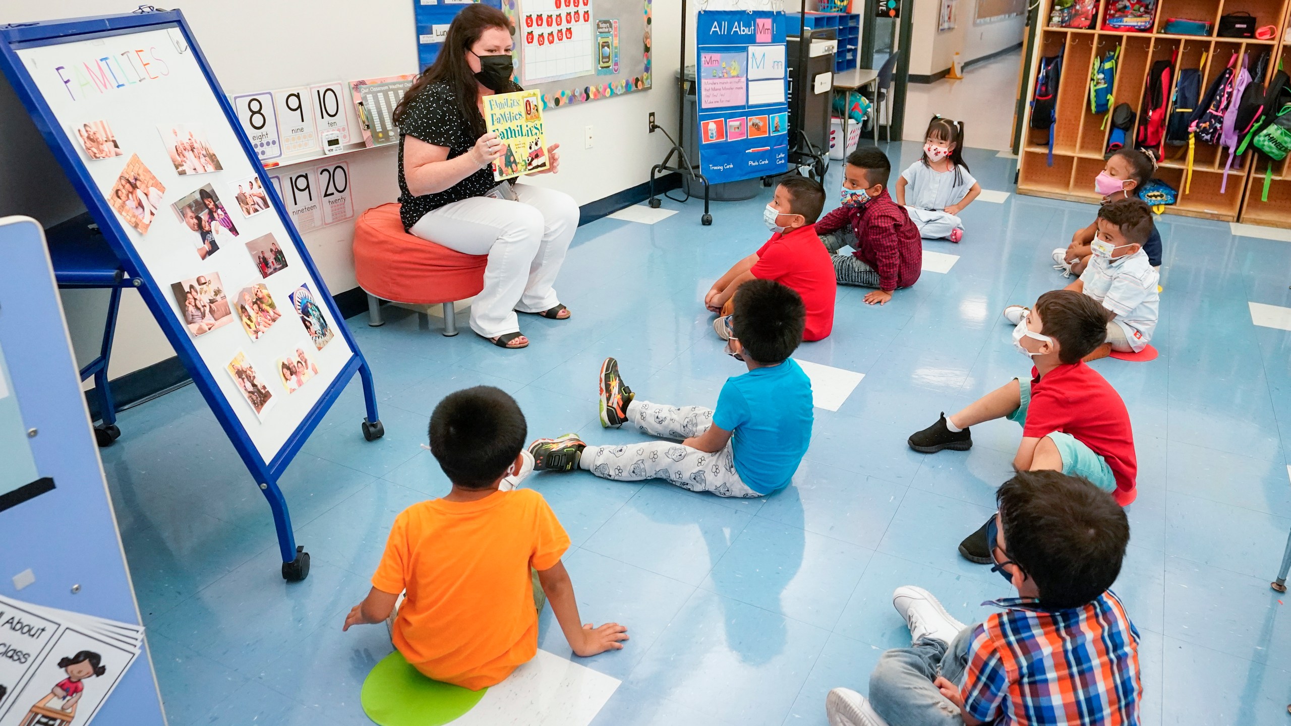 In this Sept. 16, 2021, file photo Pre-K teacher Vera Csizmadia teaches 3-and 4-year-old students in her classroom at the Dr. Charles Smith Early Childhood Center in Palisades Park, N.J. As Democrats push ahead with President Joe Biden’s $3.5 trillion rebuilding plan, they are promising historic investments across all levels of education. The proposal includes universal prekindergarten, two years of free community college and expanded child care subsidies, among others. (AP Photo/Mary Altaffer, File)