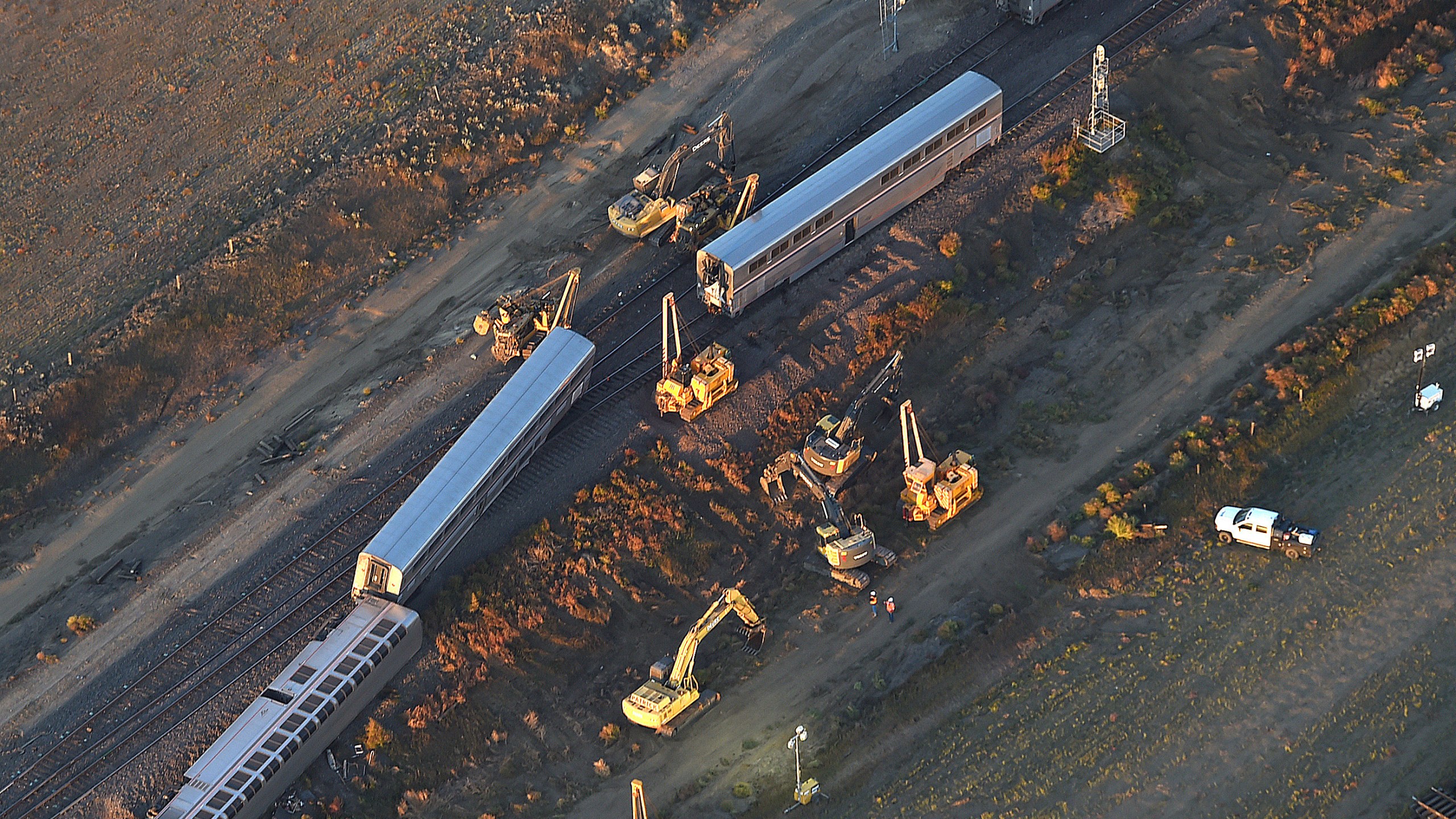 This aerial view taken Sunday, Sept. 26, 2021, shows part of an Amtrak train that derailed in north-central Montana Saturday that killed multiple people and left others hospitalized, officials said. (Larry Mayer/The Billings Gazette via AP)