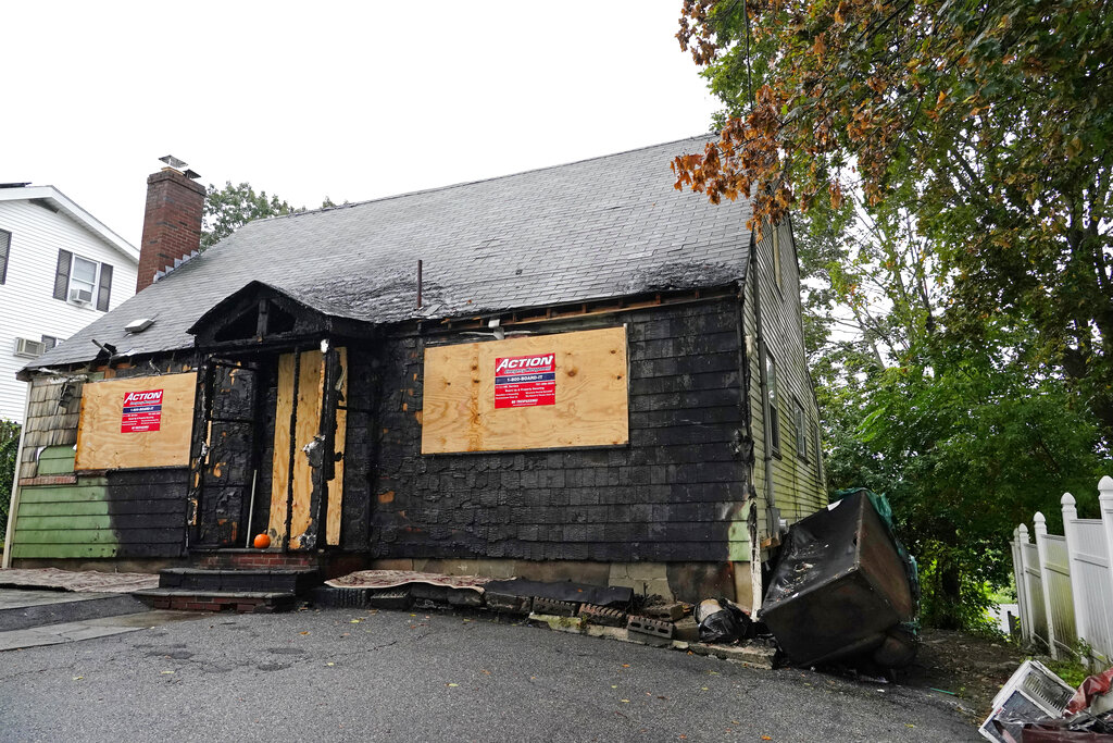 A home that was seriously damaged by fire is seen, Tuesday, Sept. 28, 2021, in Melrose, Mass. (AP Photo/Elise Amendola)