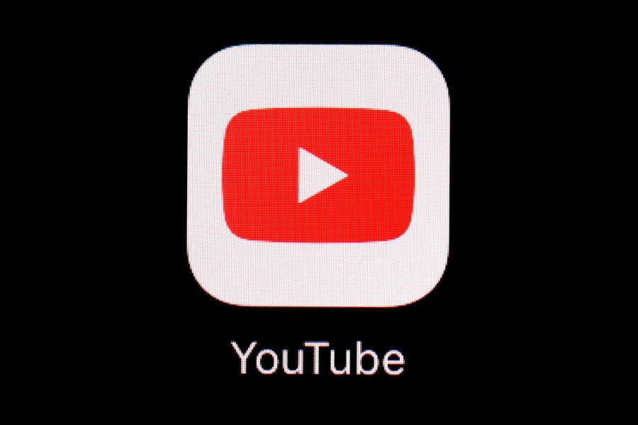 This March 20, 2018, file photo shows the YouTube app on an iPad in Baltimore. Video-sharing tech platform YouTube on Wednesday, Sept. 29, 2021, announced immediate bans on false claims that vaccines are dangerous and cause health issues like autism, cancer or infertility. (AP Photo/Patrick Semansky, File)