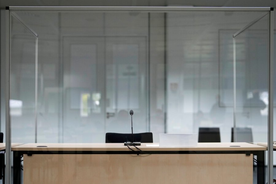 The seat of the accused is empty at the courtroom prior to a trial against a 96-year-old former secretary for the SS commander of the Stutthof concentration camp at the court in Itzehoe, Germany, Thursday, Sept. 30, 2021. (AP Photo/Markus Schreiber, Pool)