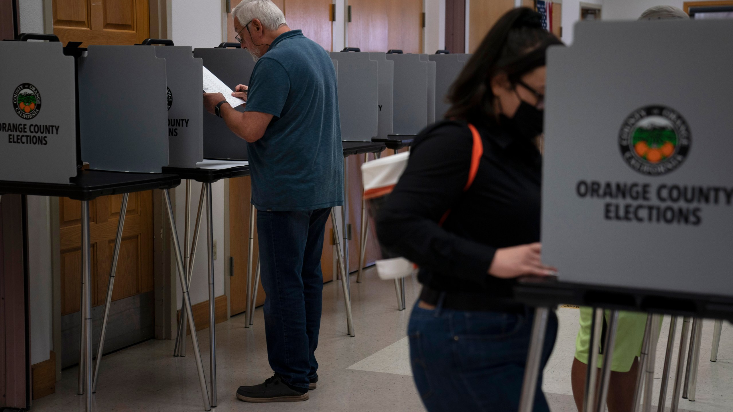 In this Sept. 14, 2021 file photo voters cast their ballots at a voting center in the Orange County city of La Habra, Calif. California Republicans needed a heroic turnout in Tuesday's recall election to have any chance of ousting Democratic Gov. Gavin Newsom, but preliminary vote tallies, Friday Sept. 17, 2021, show overall turnout was around 55%, far below the 80% that voted in the 2020 presidential contest. (AP Photo/Jae C. Hong)