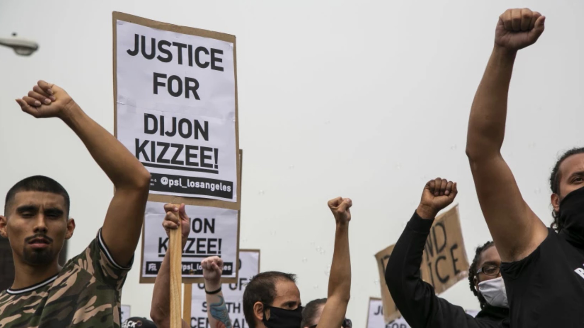 Protesters raise their fists as they march down Vermont Ave. during a protest calling for justice and in honor of Dijon Kizzee on Sept. 12, 2020, in South Los Angeles. Kizzee was killed by L.A. County sheriff’s deputies in the Westmont area. (Josie Norris / Los Angeles Times)