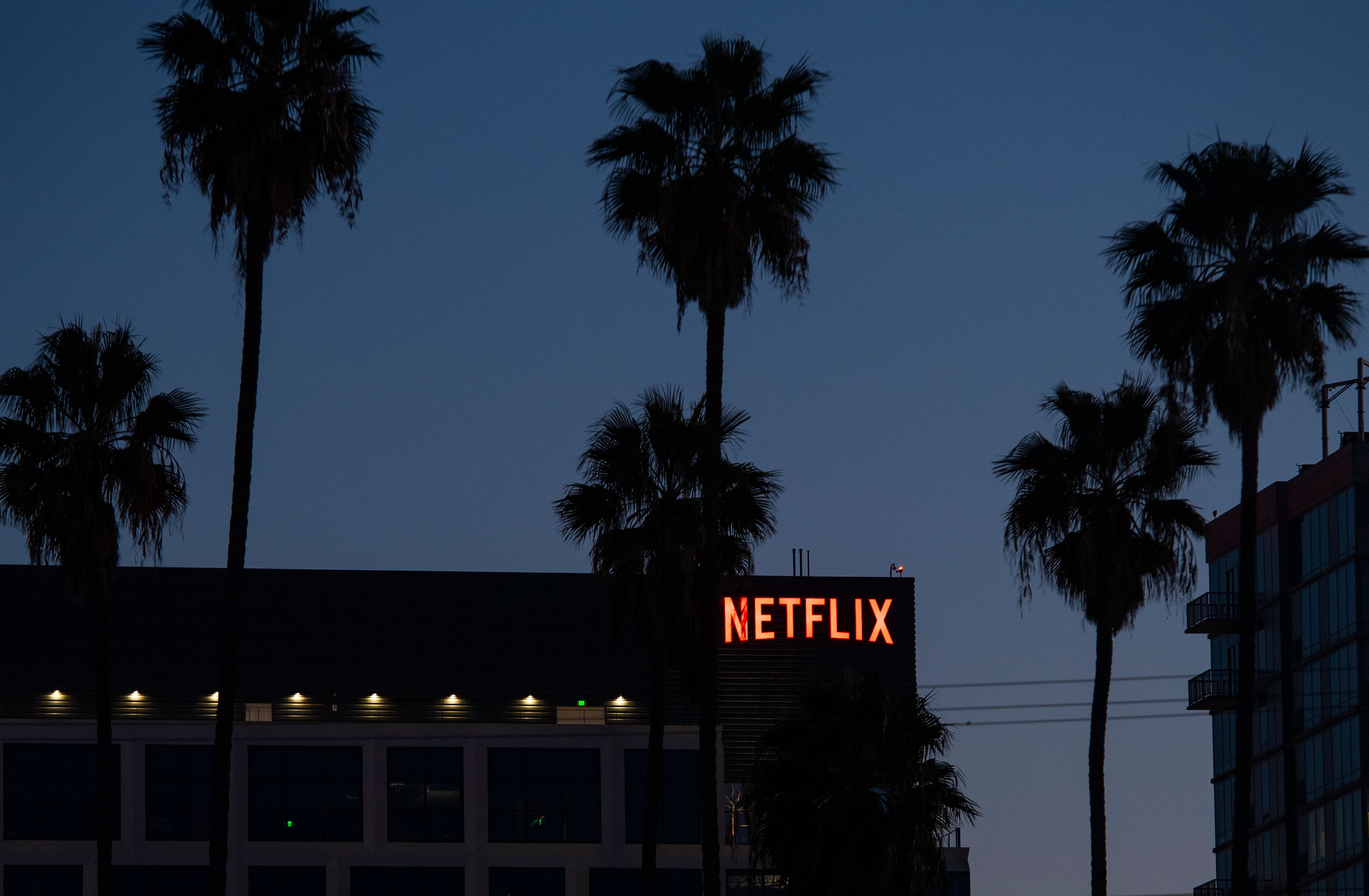 The Netflix logo sign is seen on top of its office building on Feb. 4, 2021 in Hollywood, California. (VALERIE MACON/AFP via Getty Images)