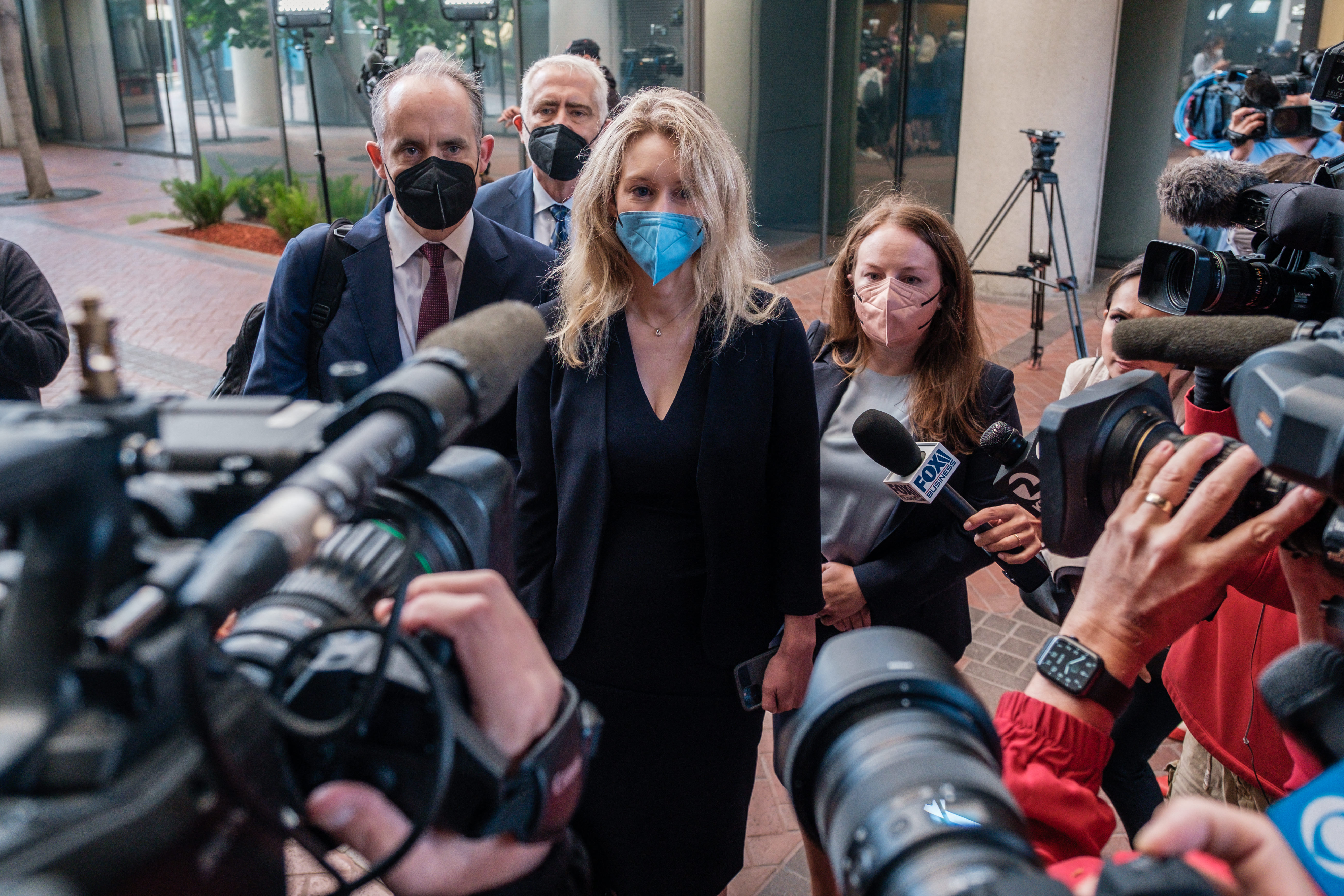 Elizabeth Holmes, the founder and former CEO of blood testing and life sciences company Theranos, arrives for the first day of jury selection in her fraud trial, outside Federal Court in San Jose, California, on Aug. 31, 2021. (NICK OTTO/AFP via Getty Images)