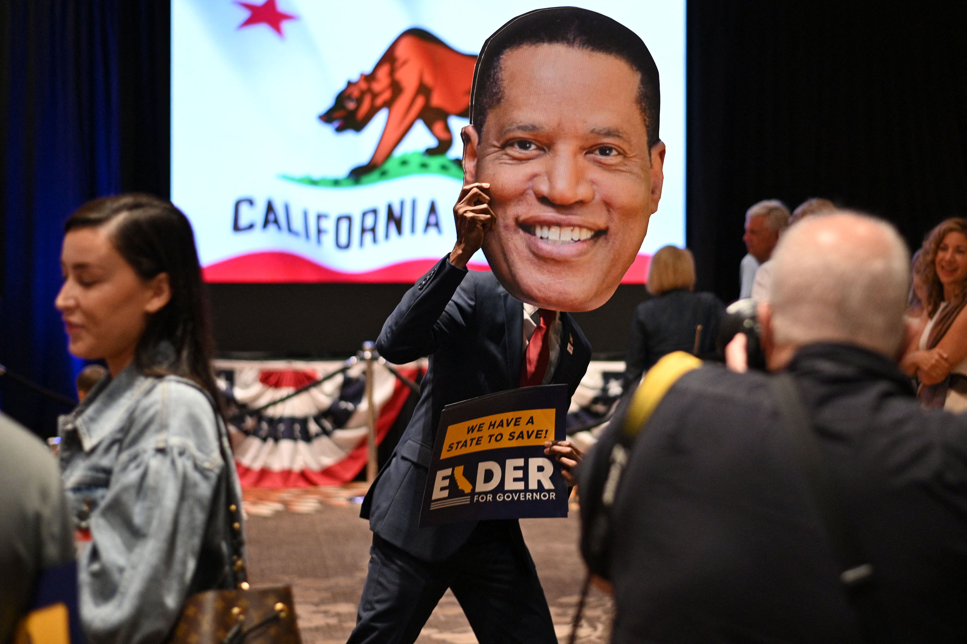 A supporter holds a cardboard cutout of California gubernatorial recall election candidate Larry Elder before Elder's arrival at his election night party in a Costa Mesa hotel on, Sept. 14, 2021. (ROBYN BECK/AFP via Getty Images)