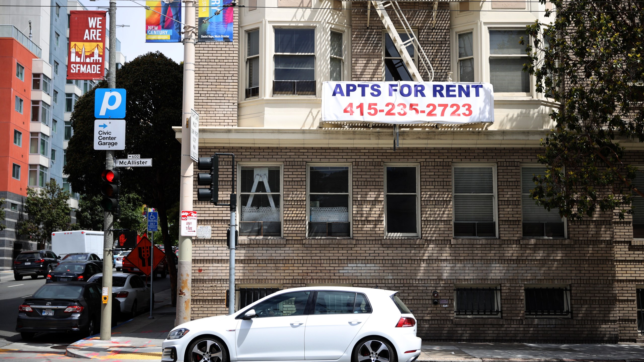 A "for rent" sign is posted on the exterior of an apartment building in San Francisco on June 2, 2021. (Justin Sullivan / Getty Images)