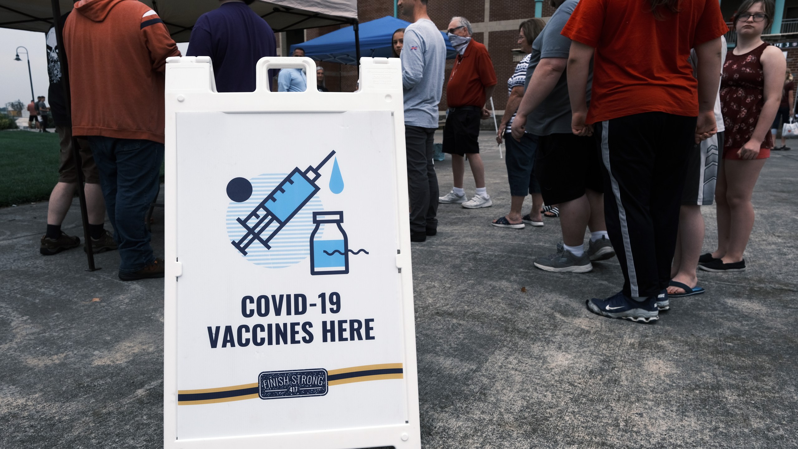 People wait to get vaccinated against COVID-19 at a baseball game on Aug. 5, 2021 in Springfield, Missouri. (Spencer Platt/Getty Images)