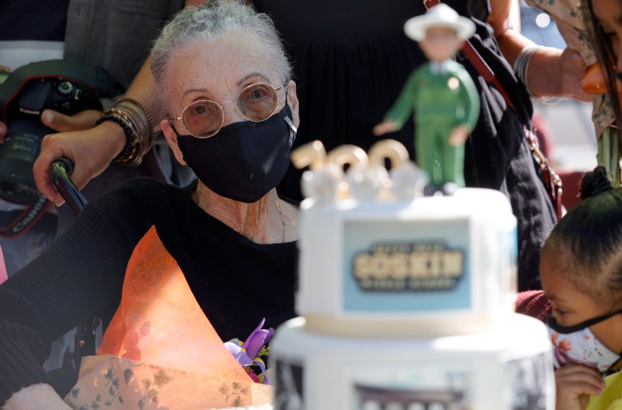 Betty Reid Soskin, the oldest full-time National Park Service ranger in the United States, looks at a birthday cake during a ceremony for the newly renamed Betty Reid Soskin Middle School on Sept. 22, 2021, in El Sobrante, California. Soskin had the school renamed after her on her 100th birthday. (Justin Sullivan/Getty Images)