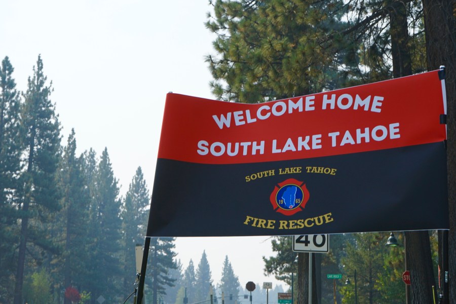 A sign outside a South Lake Tahoe Fire Station welcomes residents back to town after the lifting of the evacuation order Monday, Sept. 6, 2021. The resort town of some 22,000 was cleared last week due to the Caldor Fire. (AP Photo/Samuel Metz)