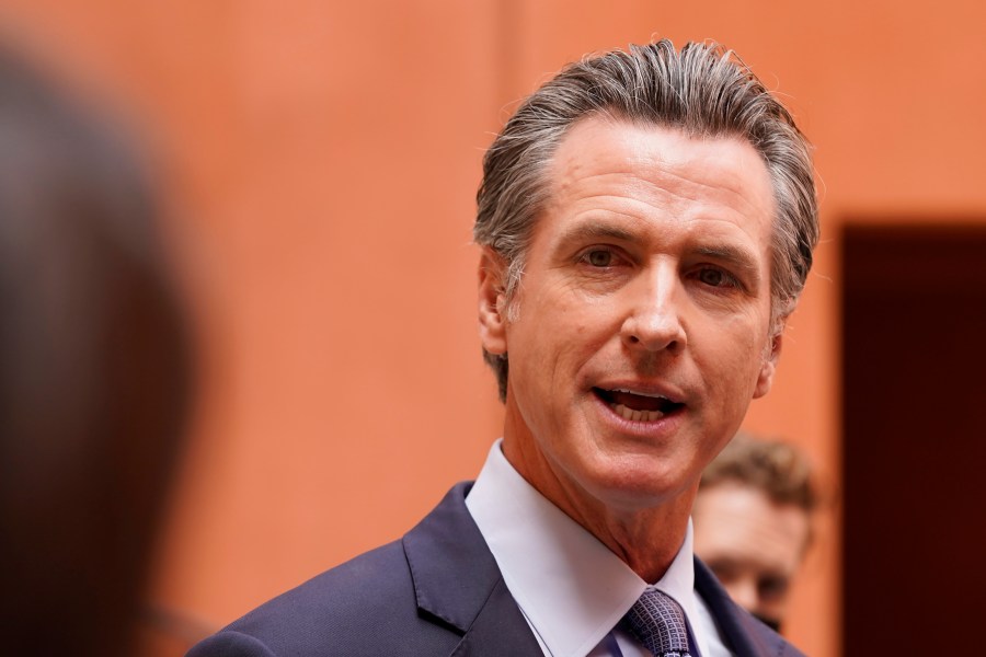 California Gov. Gavin Newsom responds to a question while meeting with reporters after casting his recall ballot at a voting center in Sacramento, Calif., Friday, Sept. 10, 2021. The last day to vote in the recall election is Tuesday Sept. 14. A majority of voters must mark "no" on the recall to keep Newsom in office. (AP Photo/Rich Pedroncelli)