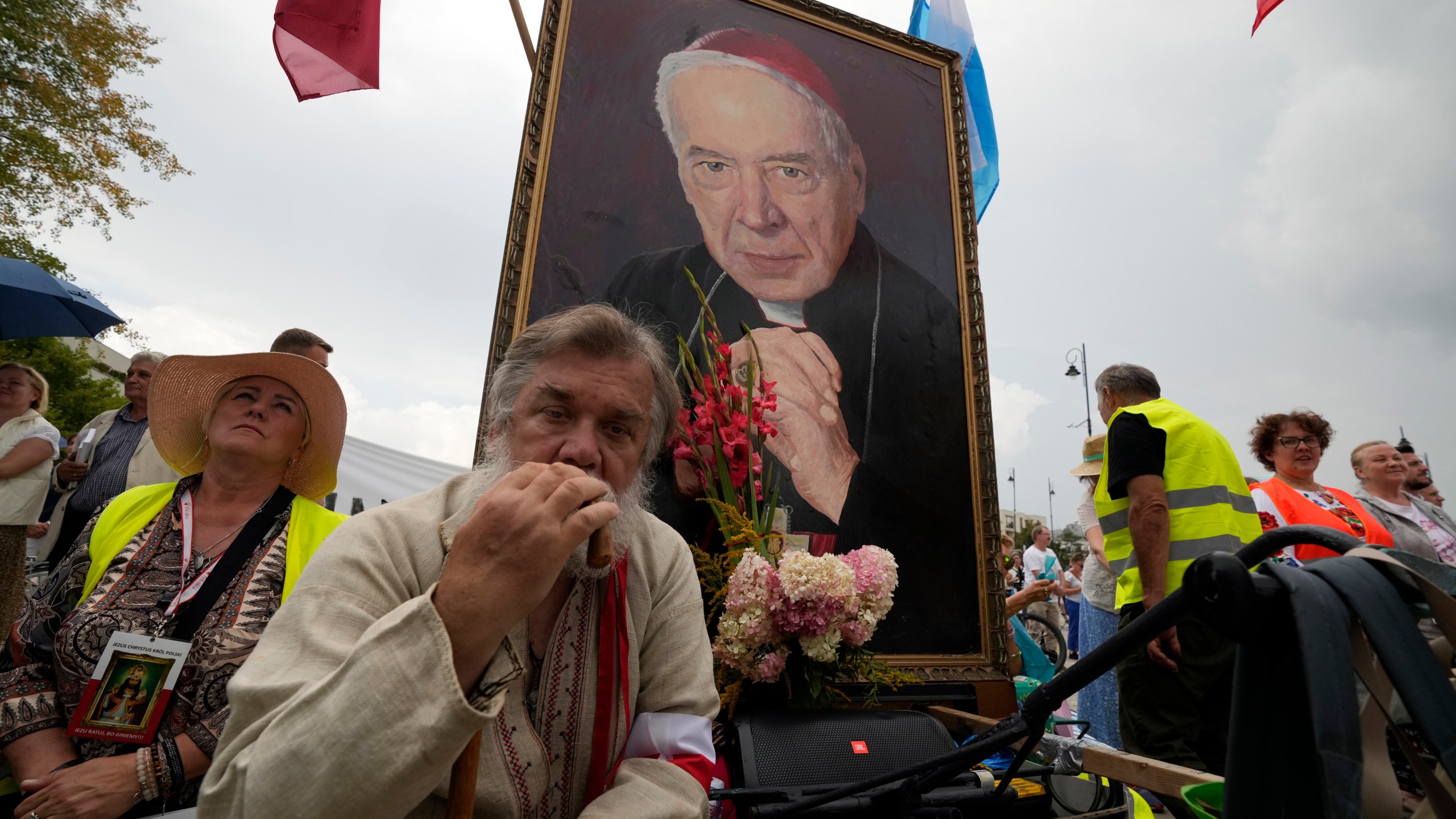 Catholic faithful attend the beatification ceremony of Polish Cardinal Stefan Wyszynski and Mother Elzbieta Roza Czacka in front of the church of Providence in Warsaw, Poland, Sunday, Sept. 12, 2021. Poland's top political leaders gathered in a Warsaw church Sunday for the beatification of two revered figures of the Catholic church — a cardinal who led the Polish church's resistance to communism and a blind nun who devoted her life to helping others who couldn't see. (AP Photo/Czarek Sokolowski)