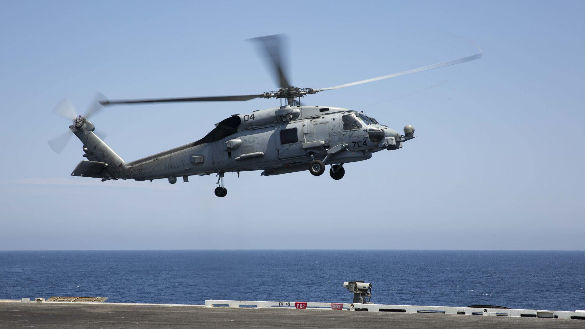 An MH-60R Sea Hawk helicopter, assigned to the "Raptors" of Helicopter Maritime Strike Squadron (HSM) 71, lands on the flight deck of the aircraft carrier USS Abraham Lincoln (CVN 72). (U.S. Navy photo by Mass Communication Specialist 2nd Class Amber Smalley/Released)