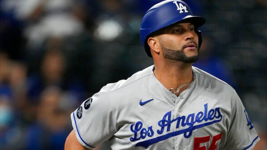 Los Angeles Dodgers pinch-hitter Albert Pujols runs up the first-base line after popping out against Colorado Rockies relief pitcher Lucas Gilbreath in the ninth inning of a baseball game Wednesday, Sept. 22, 2021, in Denver. (AP Photo/David Zalubowski)