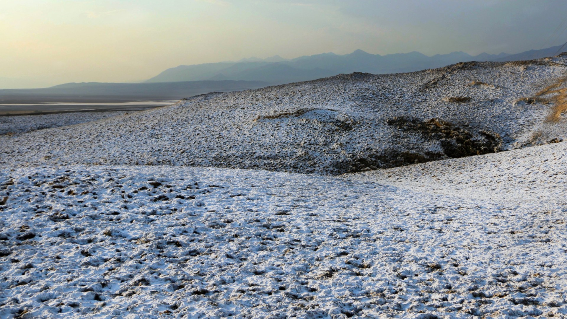 A snow-like dusting at Death Valley National Park was caused by rain soaking into the soil and dissolving salt beneath the surface, rangers said.(M. Gage / National Park Service)