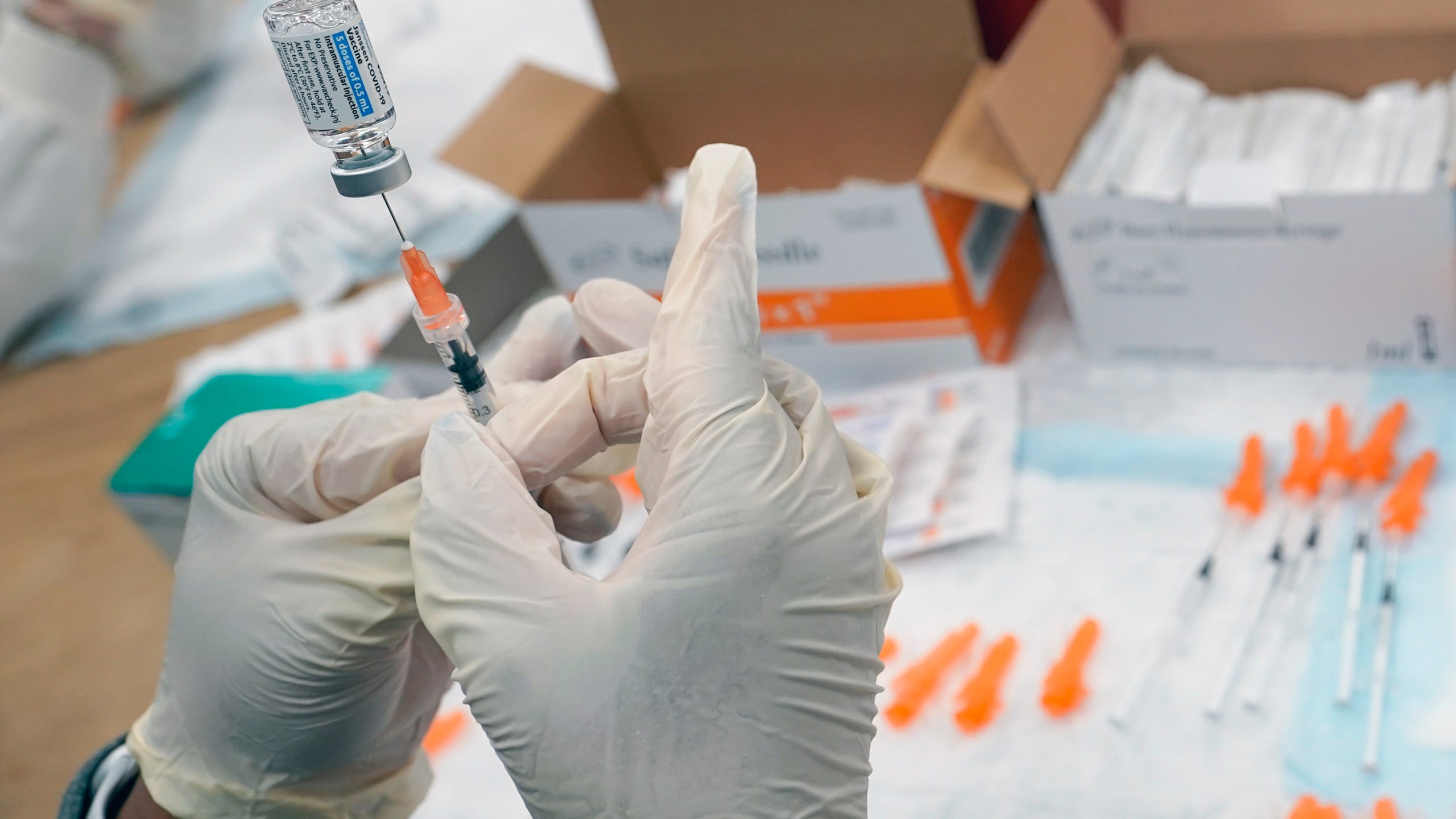 In this April 8, 2021, file photo, registered nurse fills a syringe with the Johnson & Johnson COVID-19 vaccine at a pop up vaccination site in the Staten Island borough of New York. (AP Photo/Mary Altaffer, File)