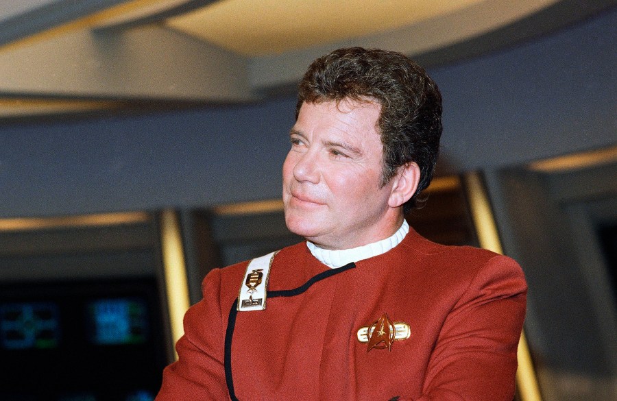 In this 1988 file photo, William Shatner, who portrays Capt. James T. Kirk, attends a photo opportunity for the film "Star Trek V: The Final Frontier." Star Trek’s Captain Kirk is rocketing into space this month — boldly going where no other sci-fi actors have gone. Jeff Bezos’ space travel company, Blue Origin, announced Monday, Oct. 4, 2021 that Shatner will blast off from West Texas on Oct. 12. (AP Photo/Bob Galbraith)