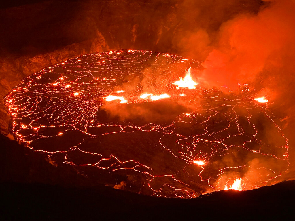 This photo provided by USGS Volcanoes shows the eruption within in Kilauea volcano's Halemaumau crater at the volcano's summit on Wednesday, Sept. 29, 2021. (USGS via AP)