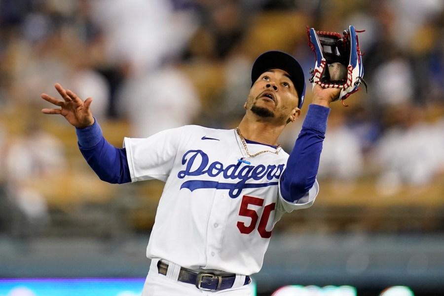 Los Angeles Dodgers right fielder Mookie Betts catches a fly ball hit by San Diego Padres' Tommy Pham during the ninth inning of a baseball game Sept. 30, 2021. (Ashley Landis/Associated Press)