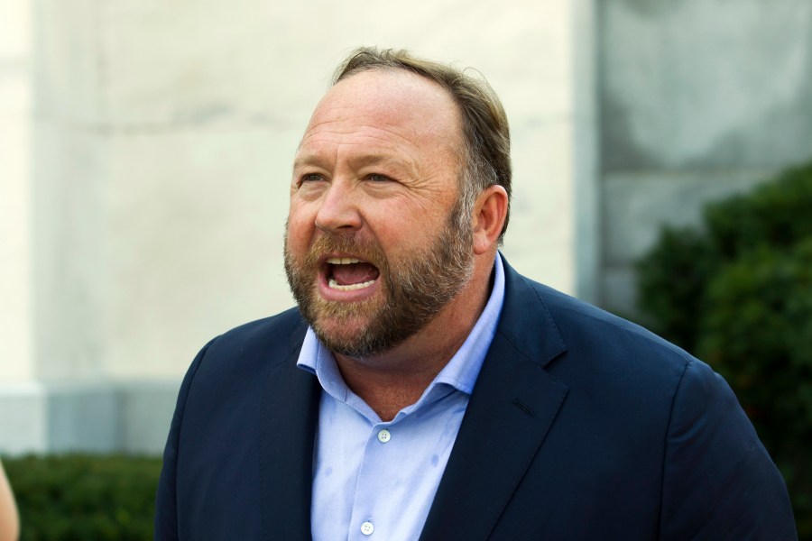 In this Sept. 5, 2018, file photo, Infowars host and conspiracy theorist Alex Jones speaks outside of the Dirksen building on Capitol Hill in Washington. A Texas judge has found Jones liable for damages in three defamation lawsuits brought by the parents of two children killed in the Sandy Hook Elementary School massacre over his claims that the shooting was a hoax. The rulings were issued on Monday, Sept. 27, 2021 and released on Thursday, Sept. 30, 2021. The cases now head to trial for juries to determine the amount of damages Jones and the other defendants will have to pay the families. (AP Photo/Jose Luis Magana, File)