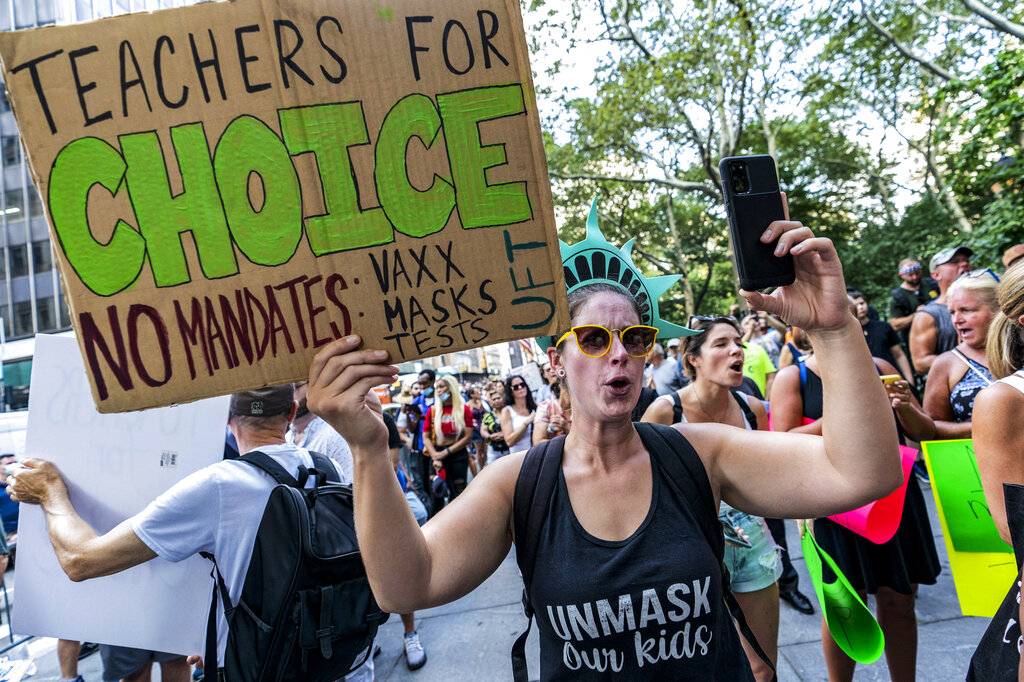 Teachers protest against the COVID-19 vaccination mandates in New York on Wednesday Aug. 25, 2021. (AP Photo/Mary Altaffer, File)