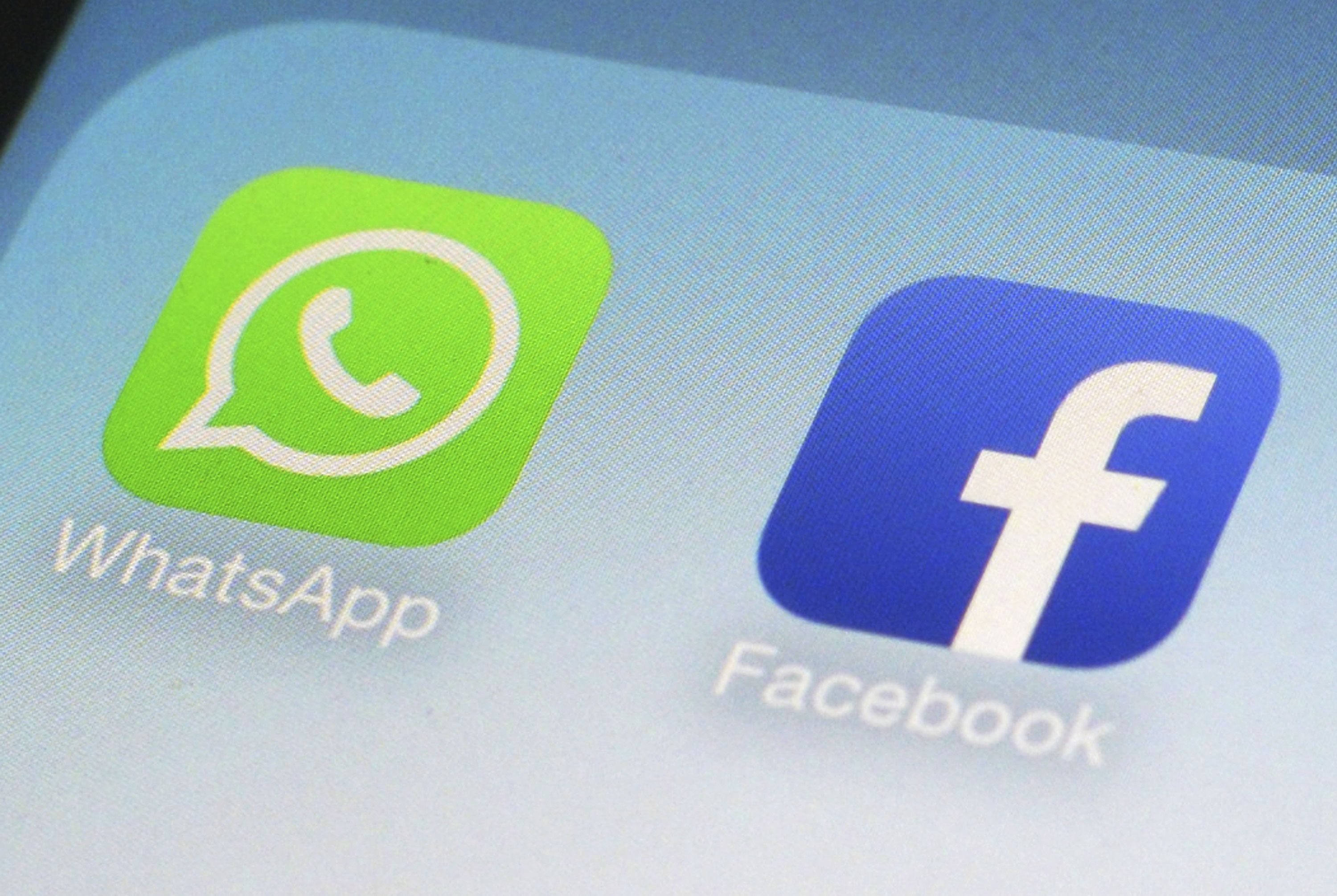 This Feb. 19, 2014, file photo, shows WhatsApp and Facebook app icons on a smartphone in New York. Facebook and its Instagram and WhatsApp platforms were down in parts of the world on Monday, Oct. 4, 2021. The company said it was “aware that some people are having trouble accessing Facebook app" and it was working on restoring access. (AP Photo/Patrick Sison, File)