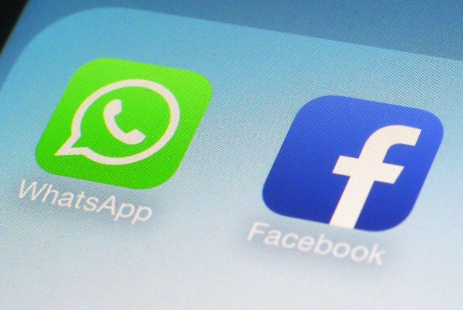 This Feb. 19, 2014, file photo, shows WhatsApp and Facebook app icons on a smartphone in New York. Facebook and its Instagram and WhatsApp platforms were down in parts of the world on Monday, Oct. 4, 2021. The company said it was “aware that some people are having trouble accessing Facebook app" and it was working on restoring access. (AP Photo/Patrick Sison, File)