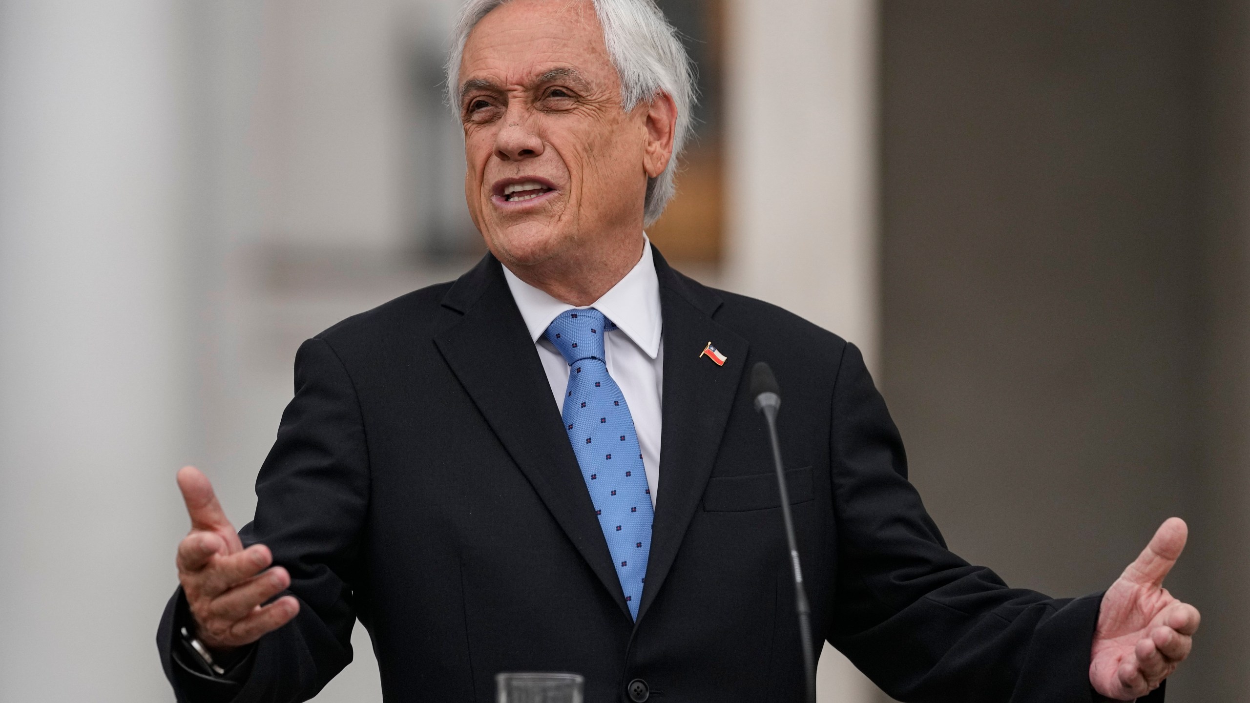 Chilean President Sebastian Piñera gives a press conference at La Moneda presidential palace in Santiago, Chile, Monday, Oct. 4, 2021. Piñera is one of hundreds of current and former politicians identified as beneficiaries of secret offshore bank accounts to hide their investments and shield assets, according to the International Consortium of Investigative Journalists in a global report released on Oct. 3, 2021, dubbed the "Pandora Papers." (AP Photo/Esteban Felix)