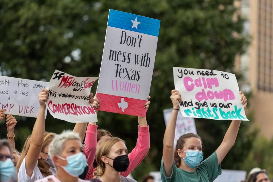 In this Oct. 2, 2021, file photo, people attend the Women's March ATX rally, at the Texas State Capitol in Austin, Texas. (AP Photo/Stephen Spillman, File)