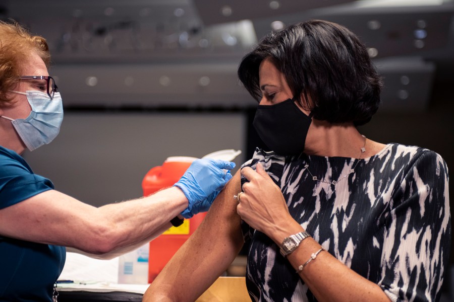 In this photo provided by the National Foundation for Infectious Diseases, CDC Director Rochelle Walensky receives her flu shot in Atlanta on Oct. 5, 2021. (National Foundation for Infectious Diseases via Associated Press)