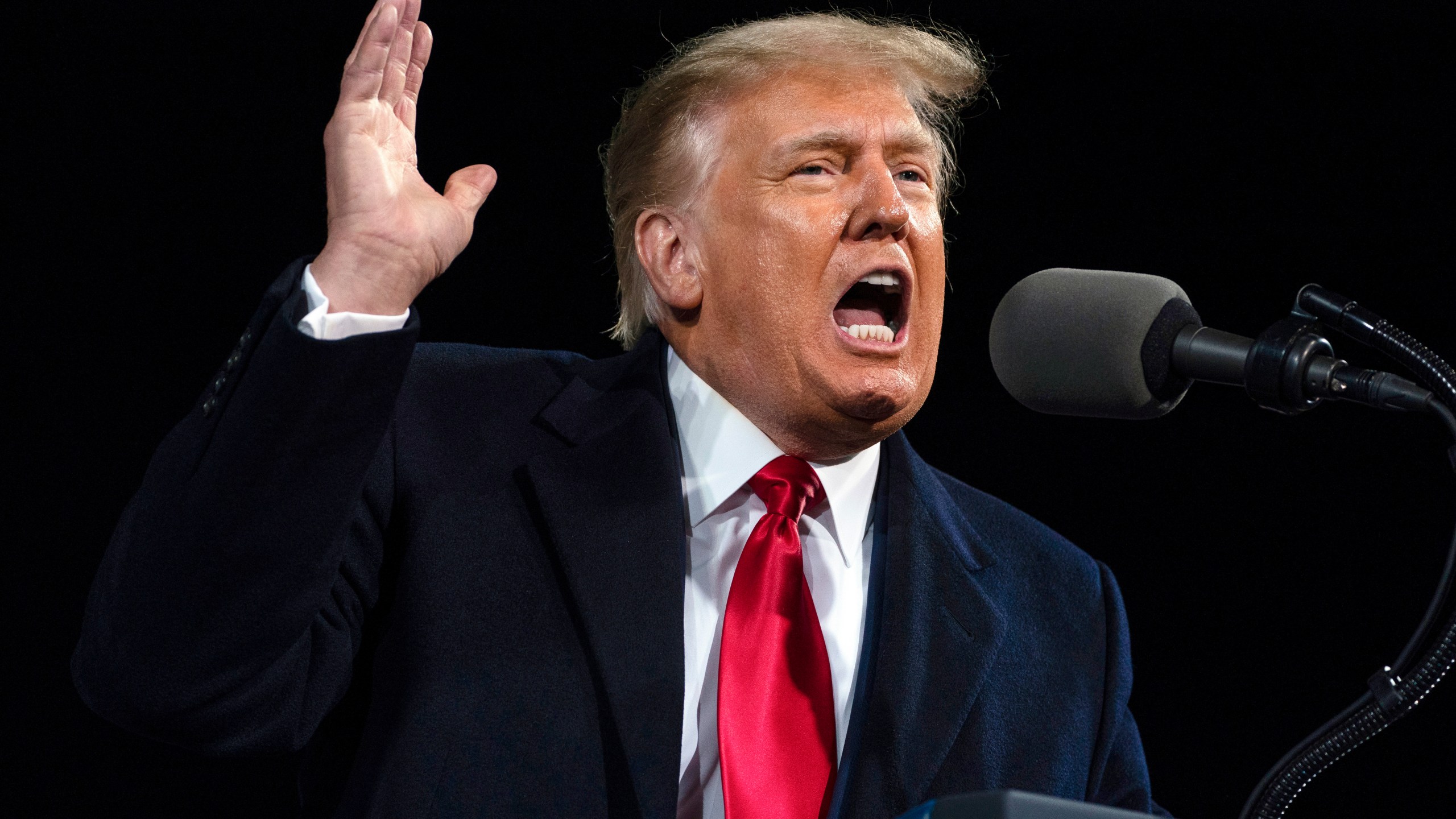 In this Dec. 5, 2020, file photo, President Donald Trump speaks at a campaign rally for Senate Republican candidates in Valdosta, Ga. A report by the Senate Judiciary Committee's Democratic majority details Trump's extraordinary effort to overturn the 2020 presidential election that he lost. His pursuit of fraud claims brought the Justice Department to the brink of chaos and prompted top officials there and at the White House to threaten to resign. (AP Photo/Evan Vucci, File)