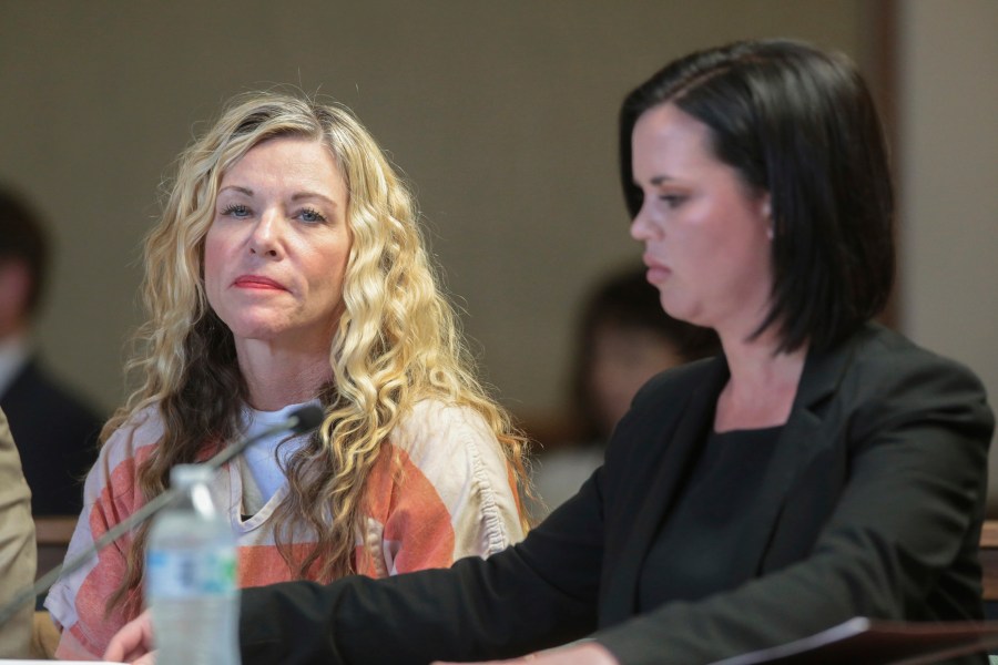 In this March 6, 2020 file photo Lori Vallow Daybell glances at the camera during her hearing, in Rexburg, Idaho. Newly released documents from the complex investigation of Daybell, accused of conspiring to kill her children and husband, reveal sordid details of a cult-like belief system of "zombies" and "vibrations", a disintegrating marriage and an affair. Documents from the Chandler Police Department in Arizona offer a detailed look at the lives of Lori and Chad Daybell via text messages, computer files and interviews with close friends and family members. (John Roark/The Idaho Post-Register via AP, Pool,File)