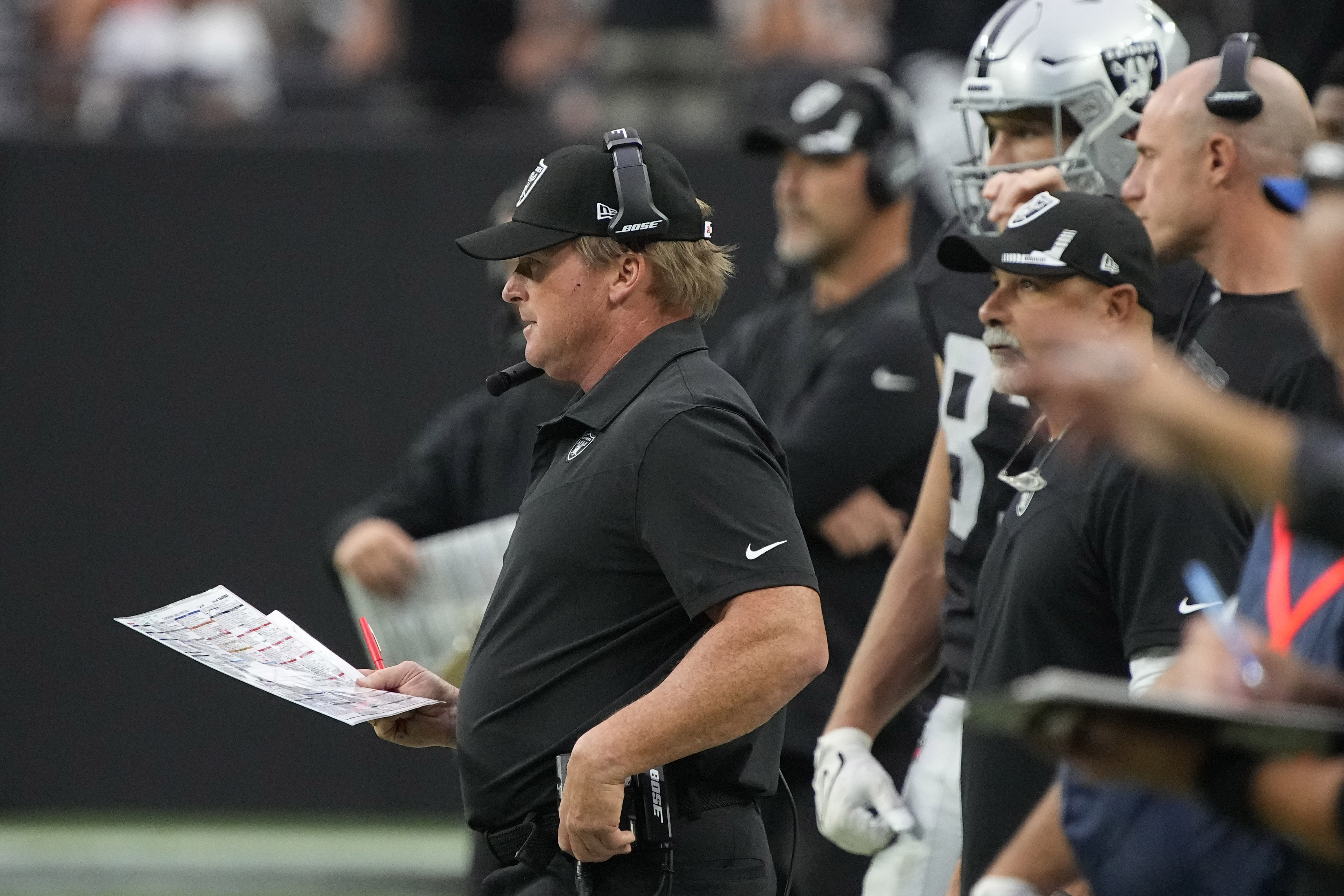 Las Vegas Raiders head coach Jon Gruden watches from the sideline during the second half of an NFL football game against the Chicago Bears, Sunday, Oct. 10, 2021, in Las Vegas. (AP Photo/Rick Scuteri)