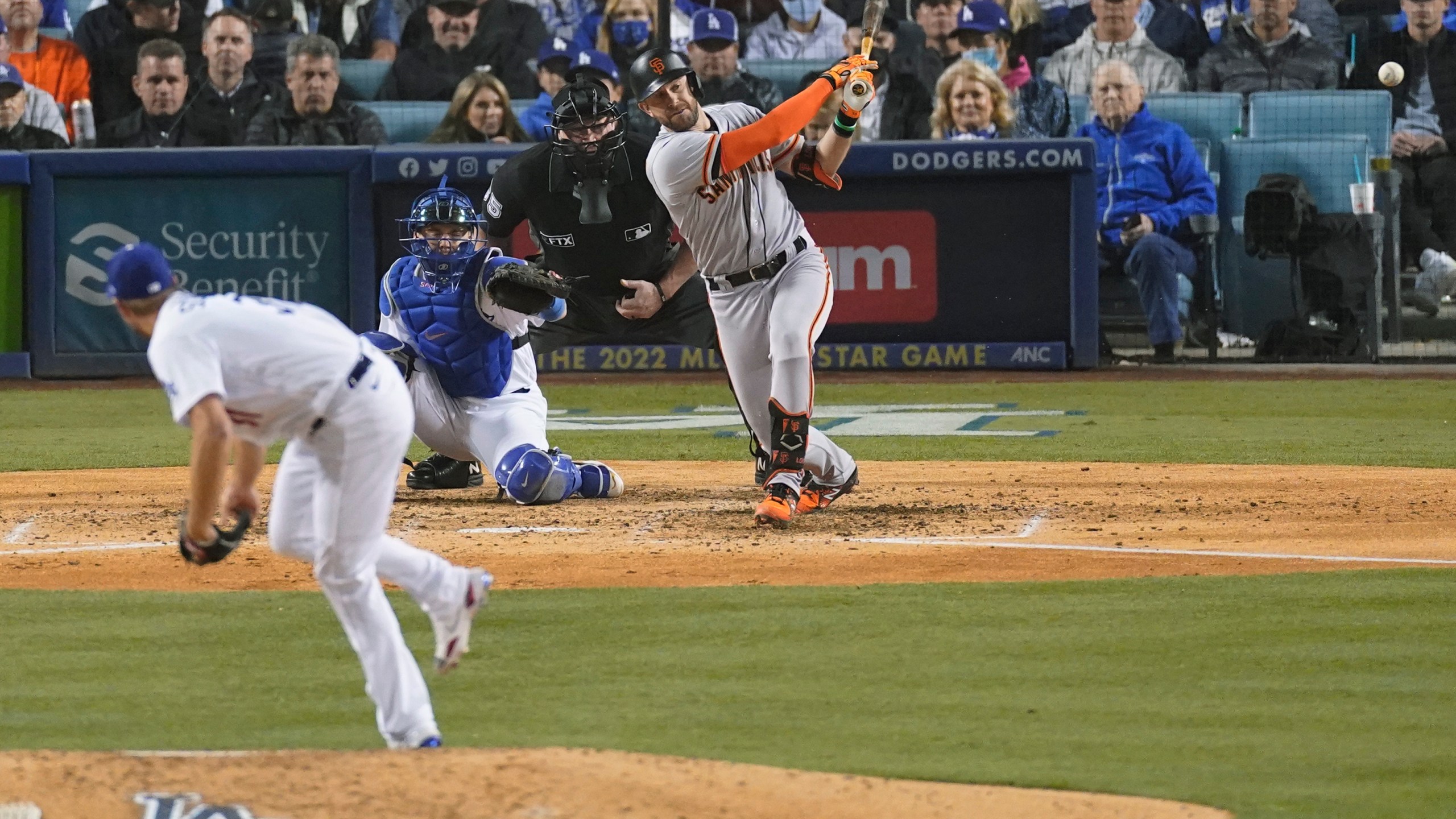 San Francisco Giants' Evan Longoria hits a solo home run off of Los Angeles Dodgers starting pitcher Max Scherzer, left, as catcher Will Smith looks on during the fifth inning of Game 3 of a baseball National League Division Series, Monday, Oct. 11, 2021, in Los Angeles. (AP Photo/Marcio Sanchez)